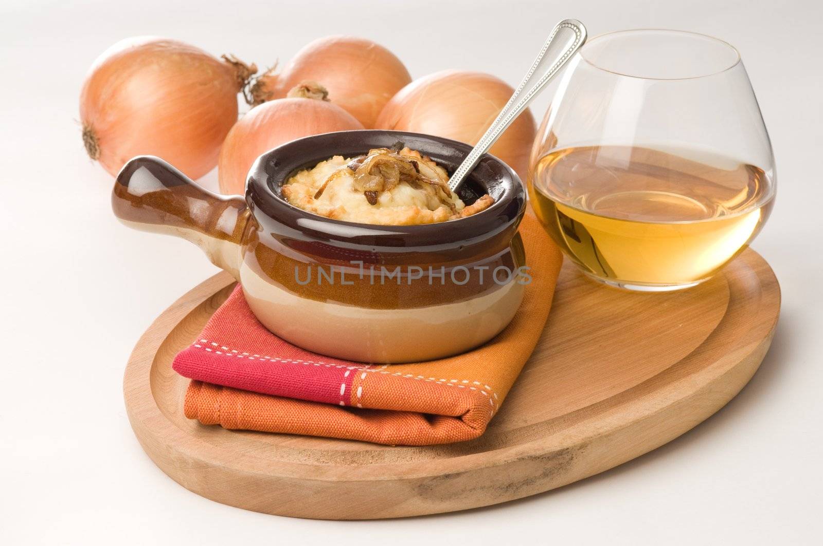 Homemade french onion soup served with white wine.