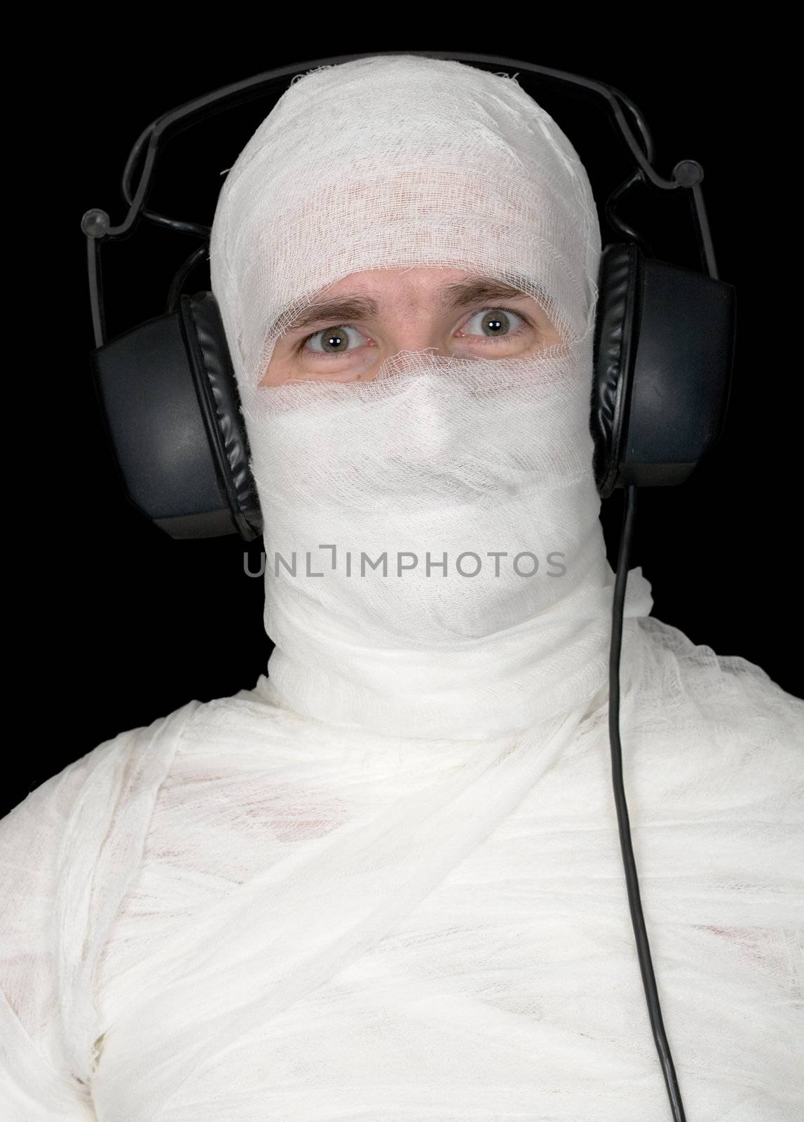 Man in bandage with ear-phones by pzaxe