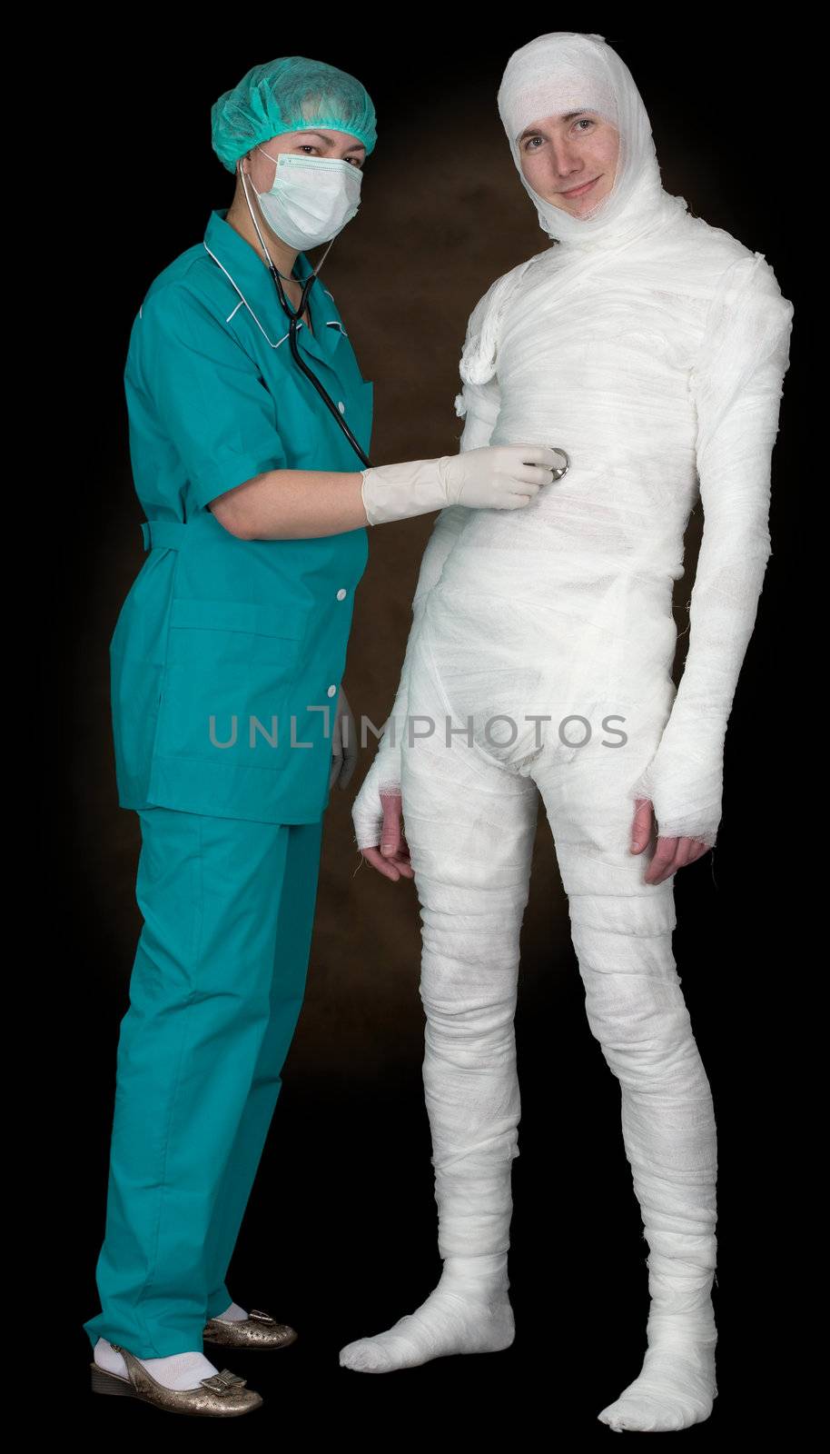 Man in bandage and nurse with stethoscope on black