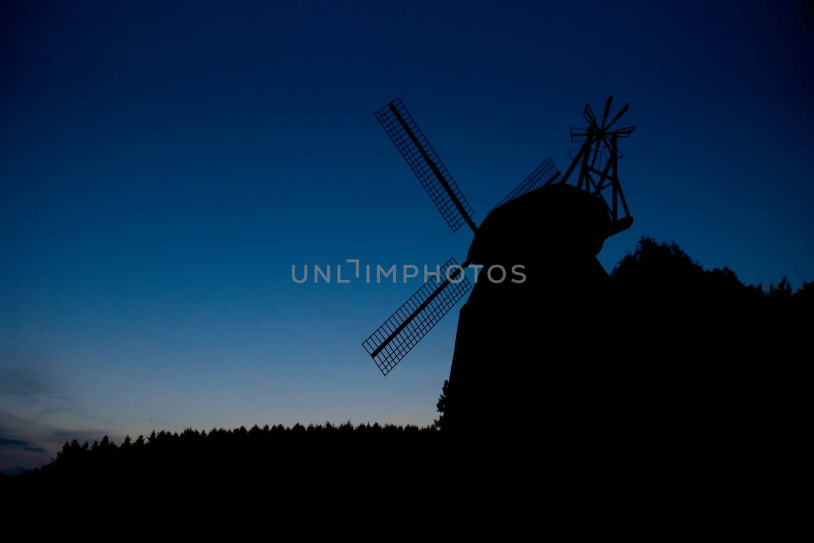 Silhouette of the windmill at dusk