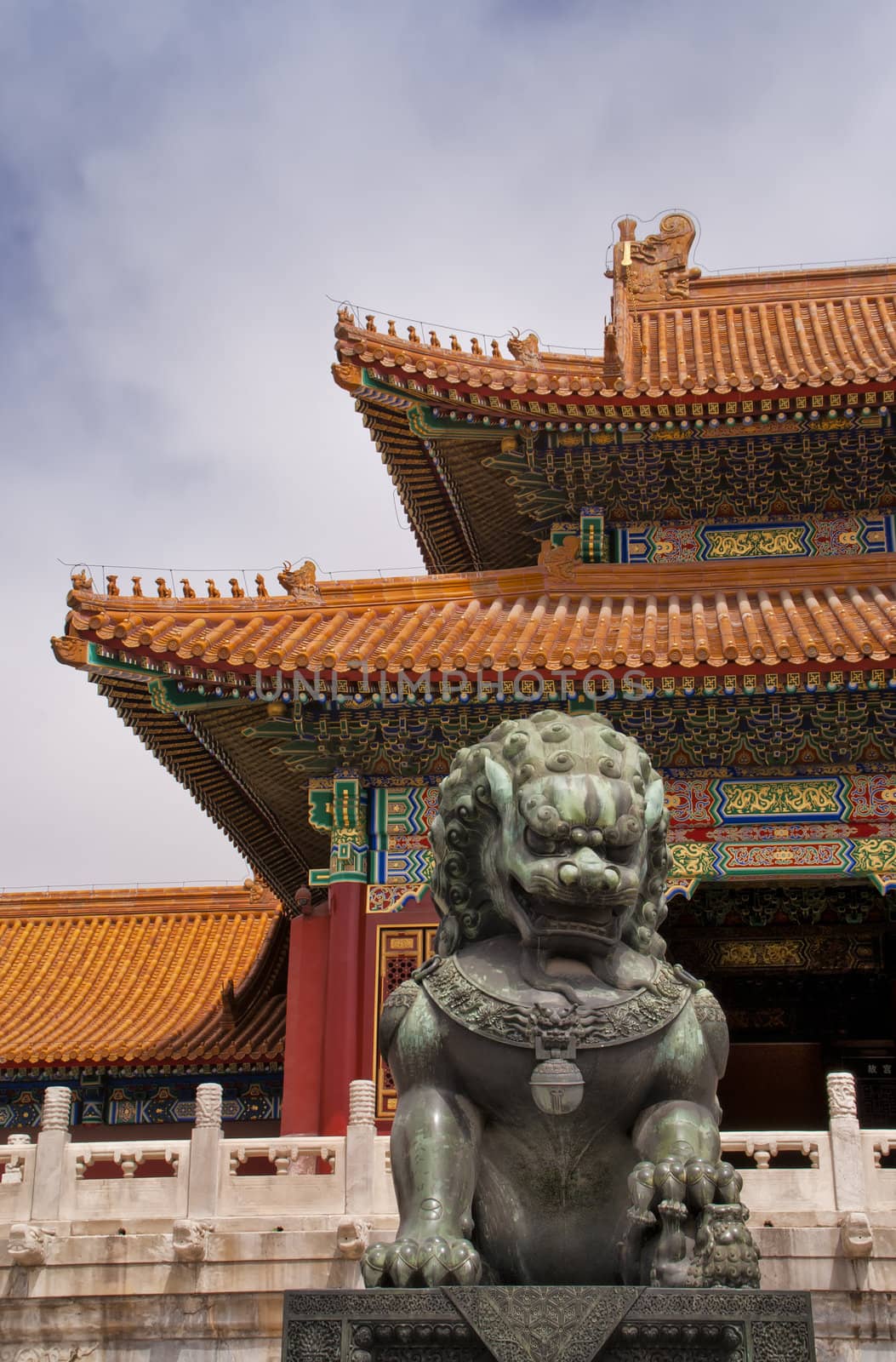 Beijing Forbidden City: lion against the corner of a roof. by Claudine
