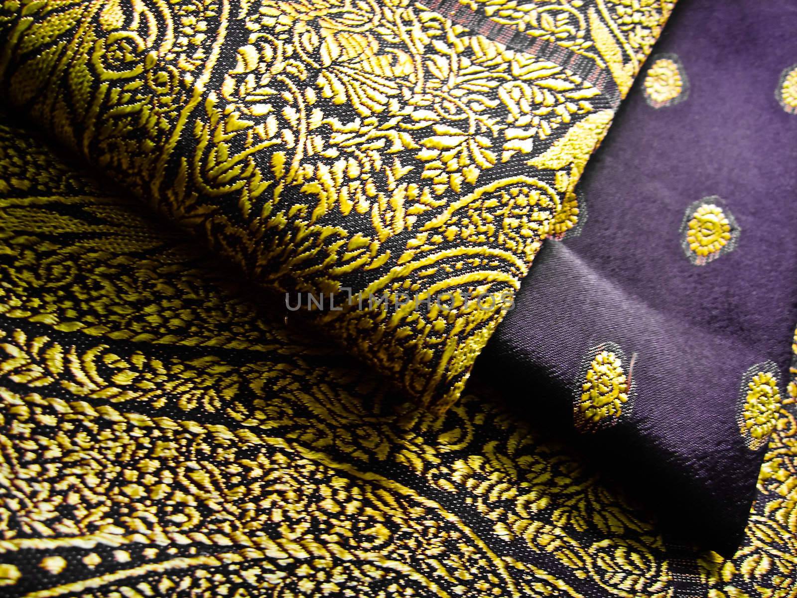 A black and yellow saree folded