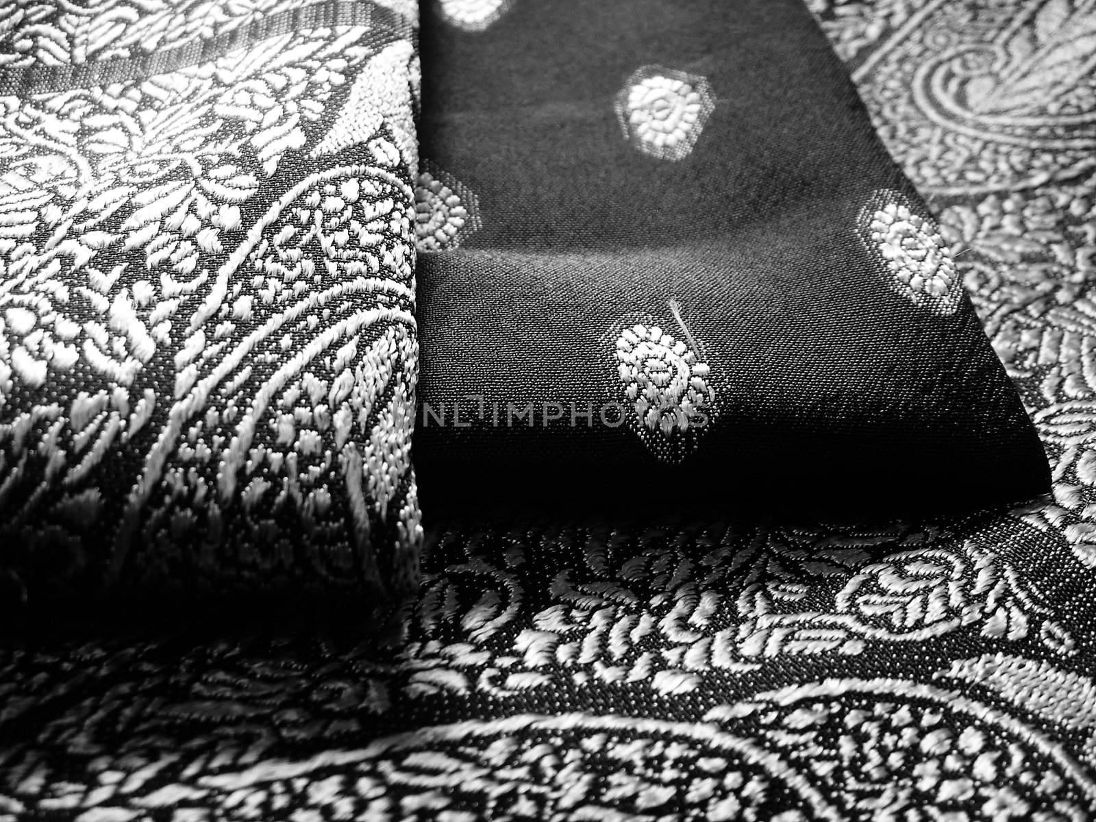 A folded saree in greyscale effect