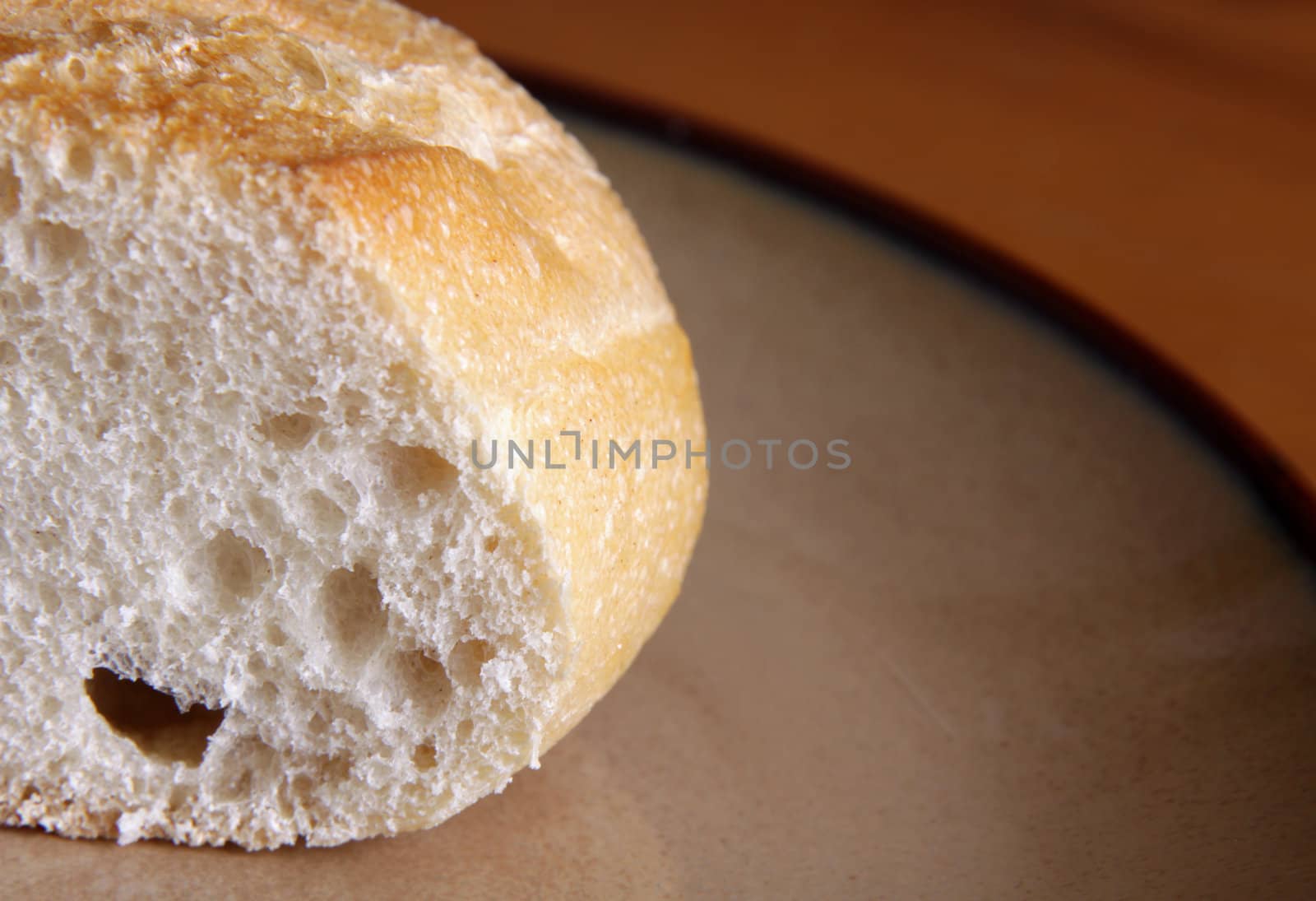 A close-up of a piece of bread sitting on a plate.
