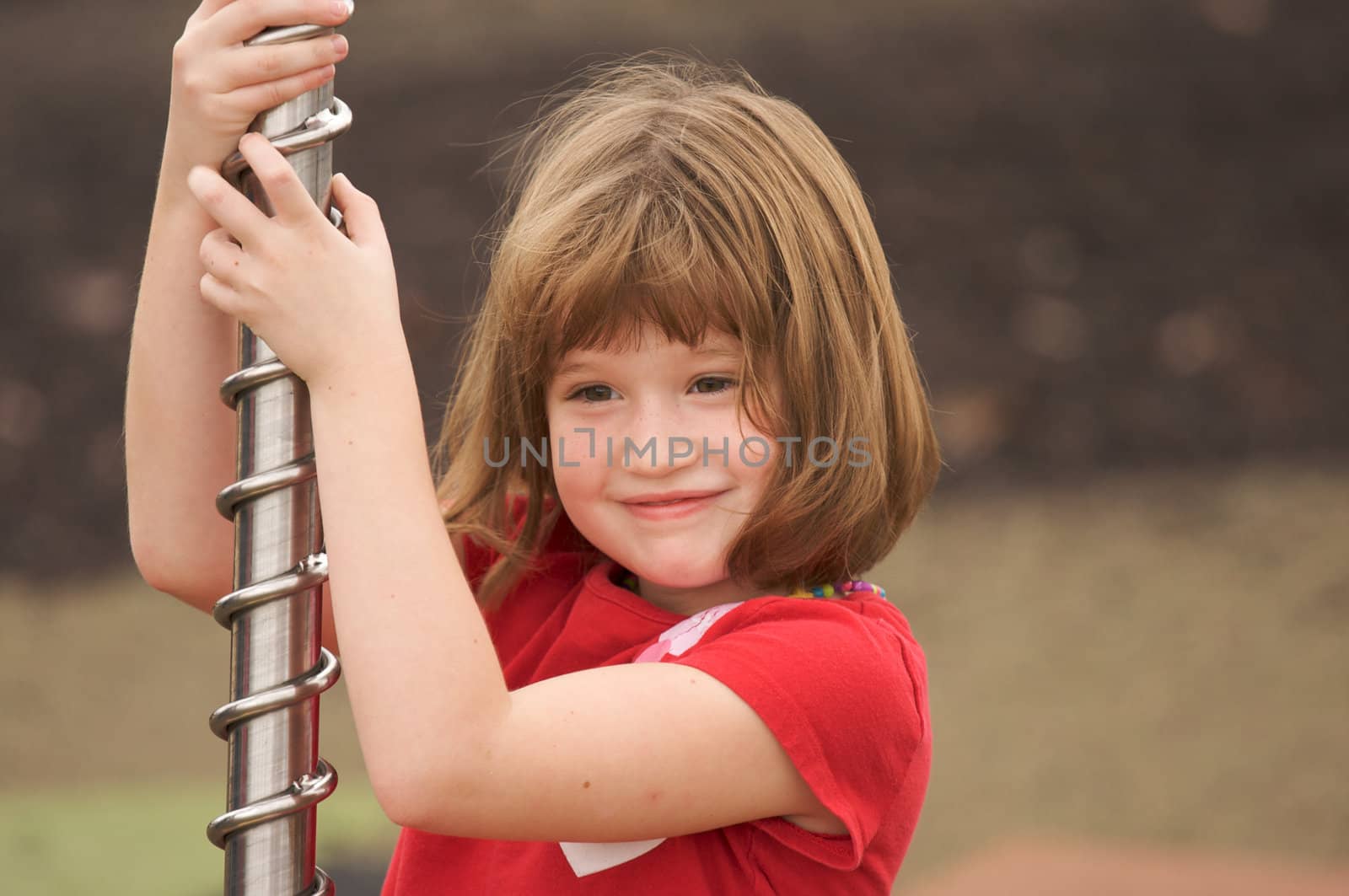 Adorable Young Girl Having Fun at the Park.