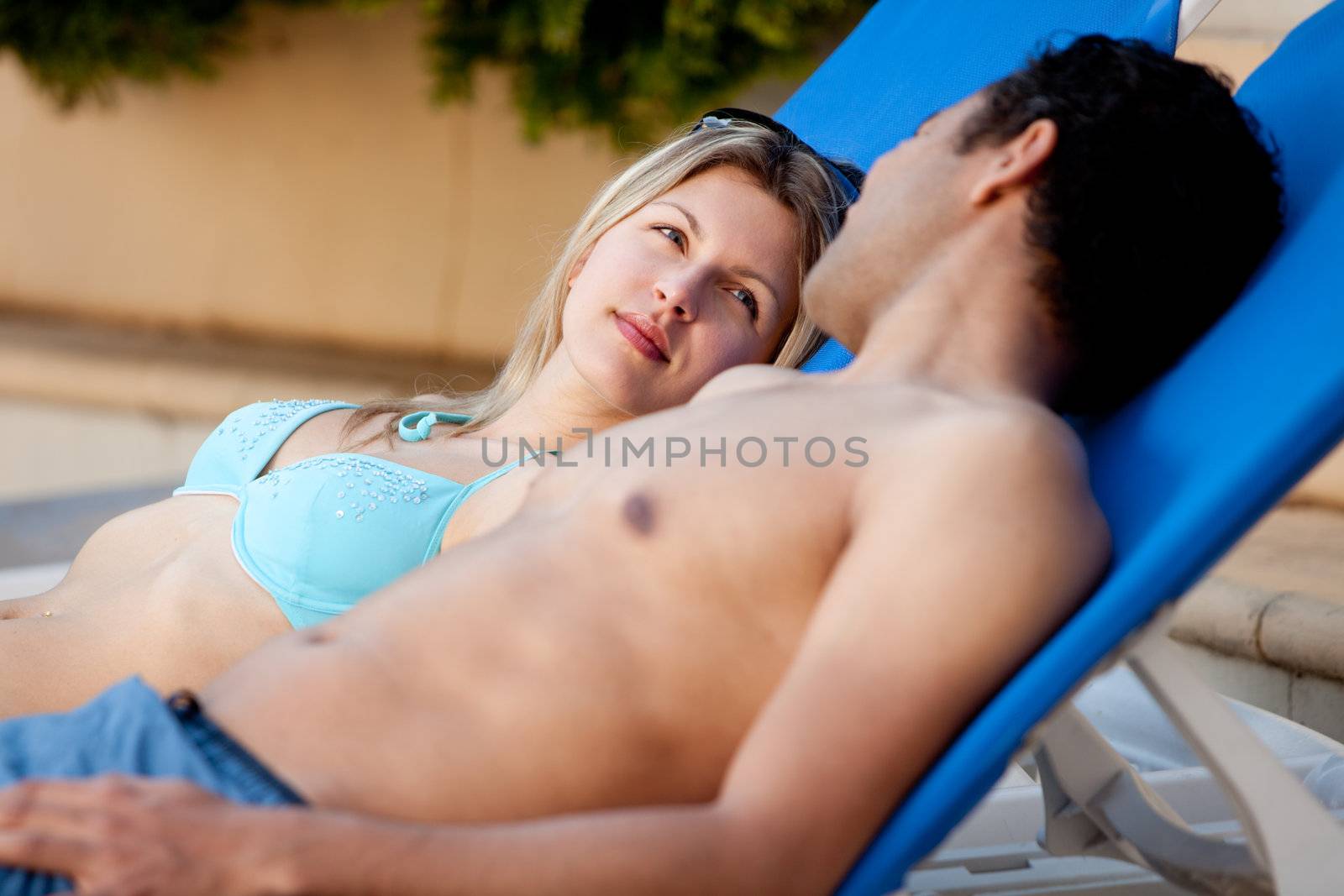 Attractive Couple by Pool by leaf