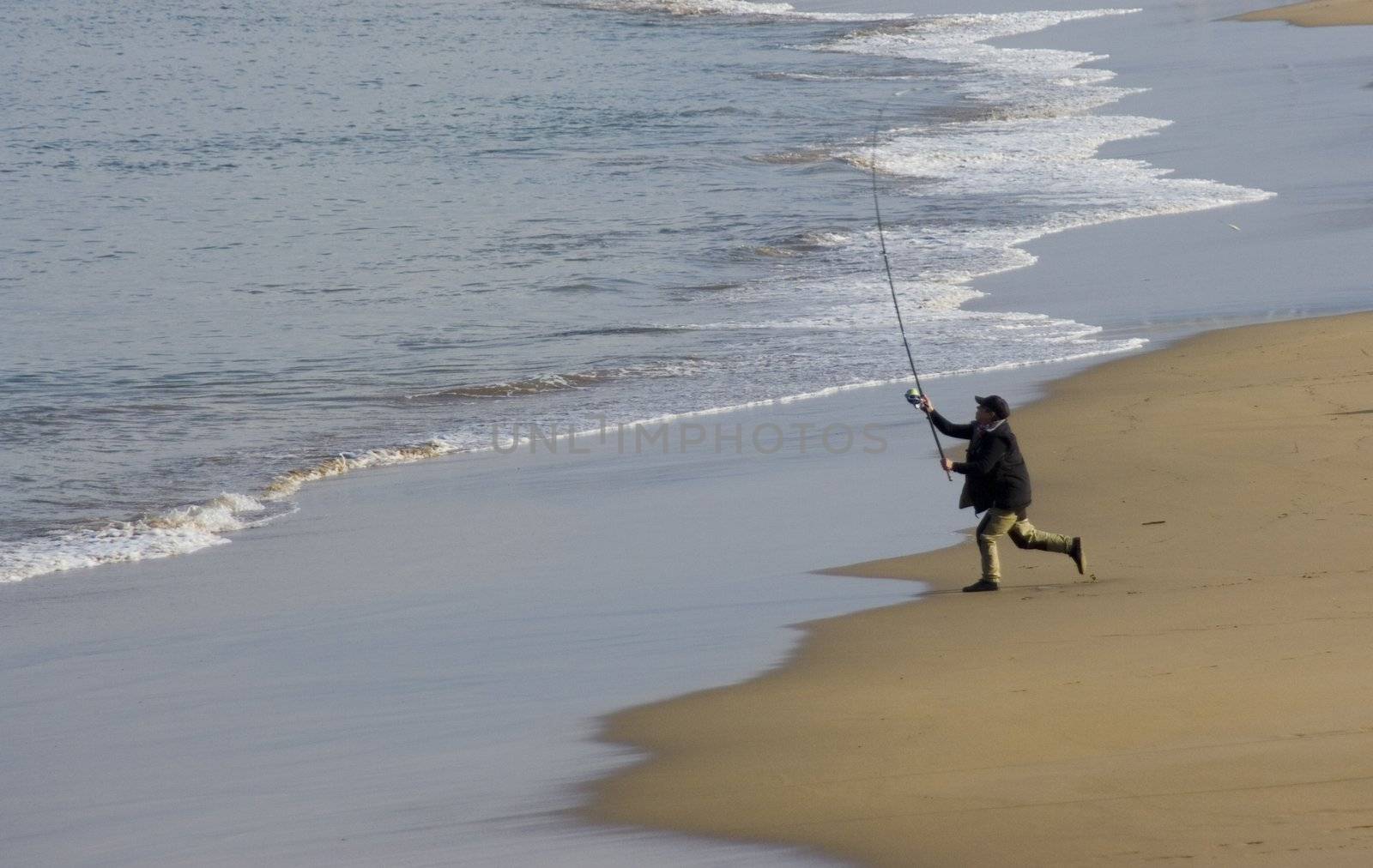 an angler fishing in the sea