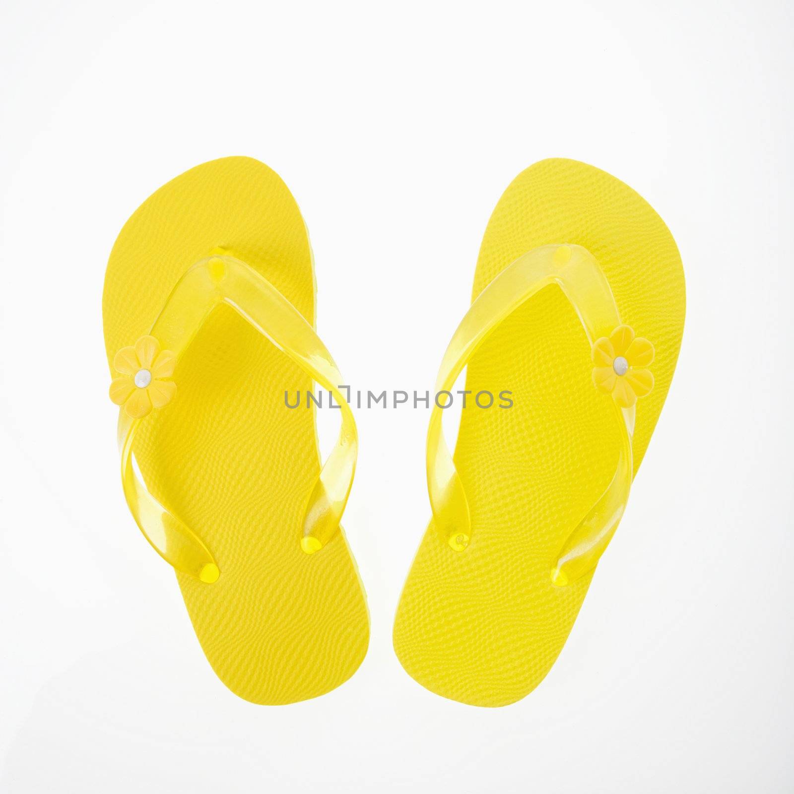 Yellow plastic thong sandals.