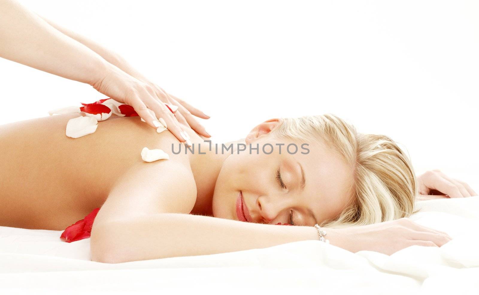 professional massage with flower petals by dolgachov