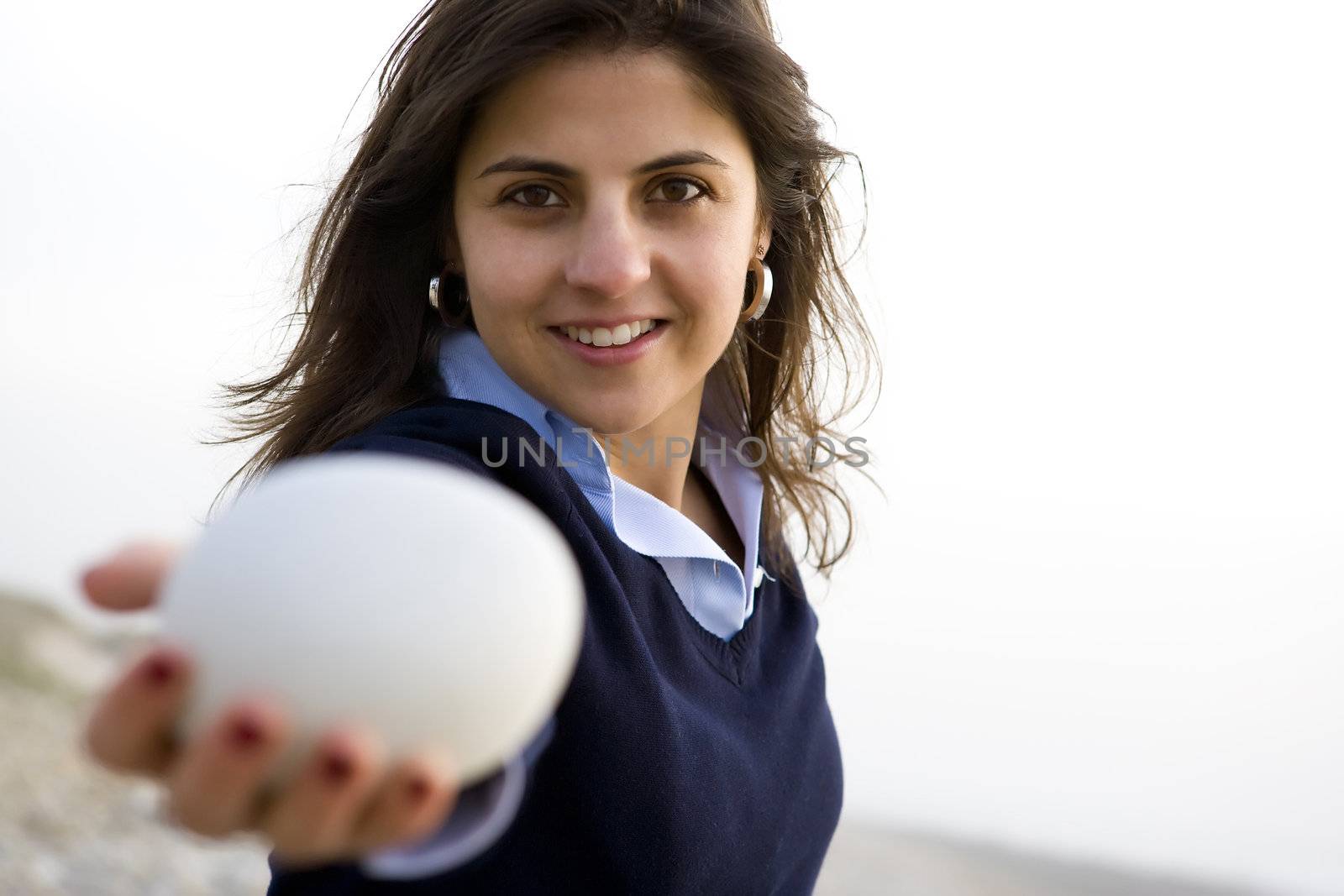 young woman holding white stone - healthy life and spa concept by mlopes