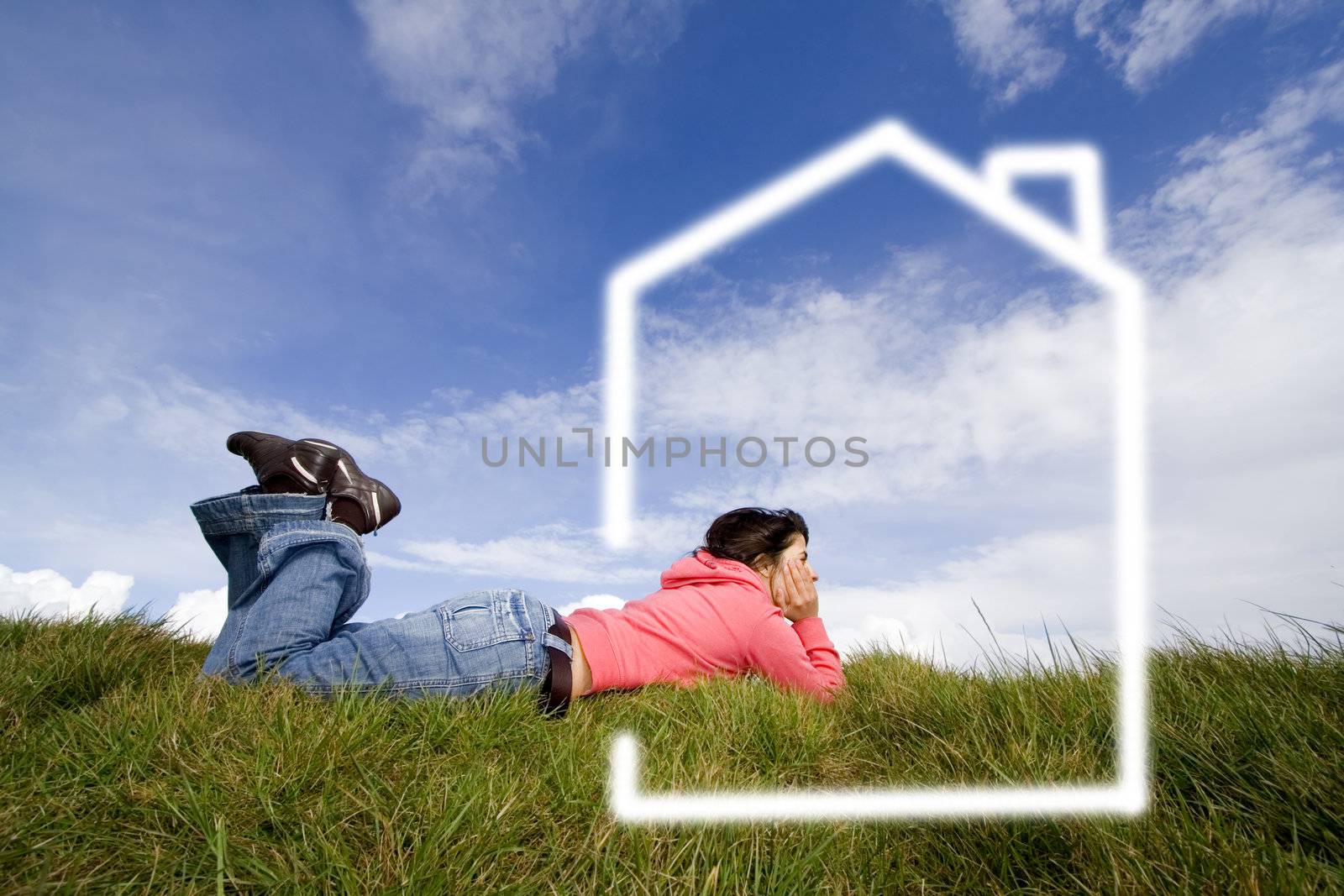 beautifull woman in grass dreaming with new house