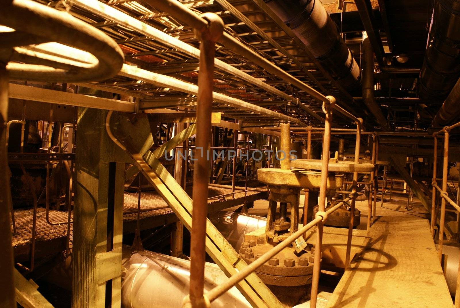 Pipes and tubes and chimney at a power plant        