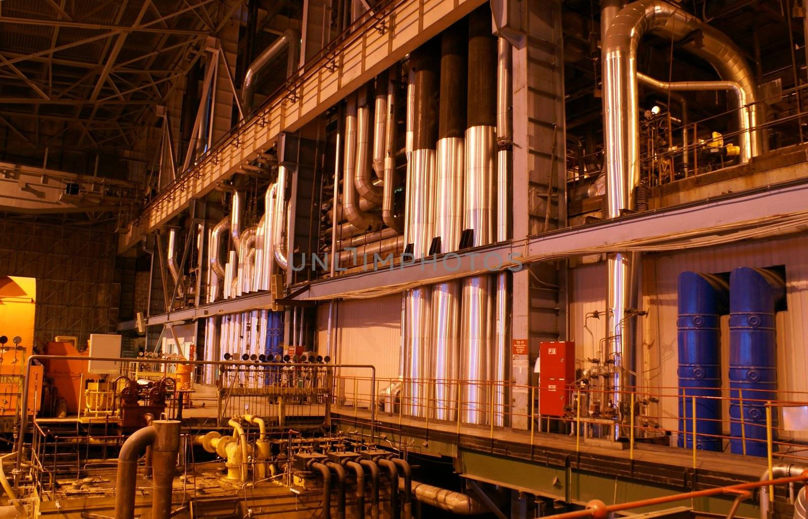 Pipes and tubes and chimney at a power plant          