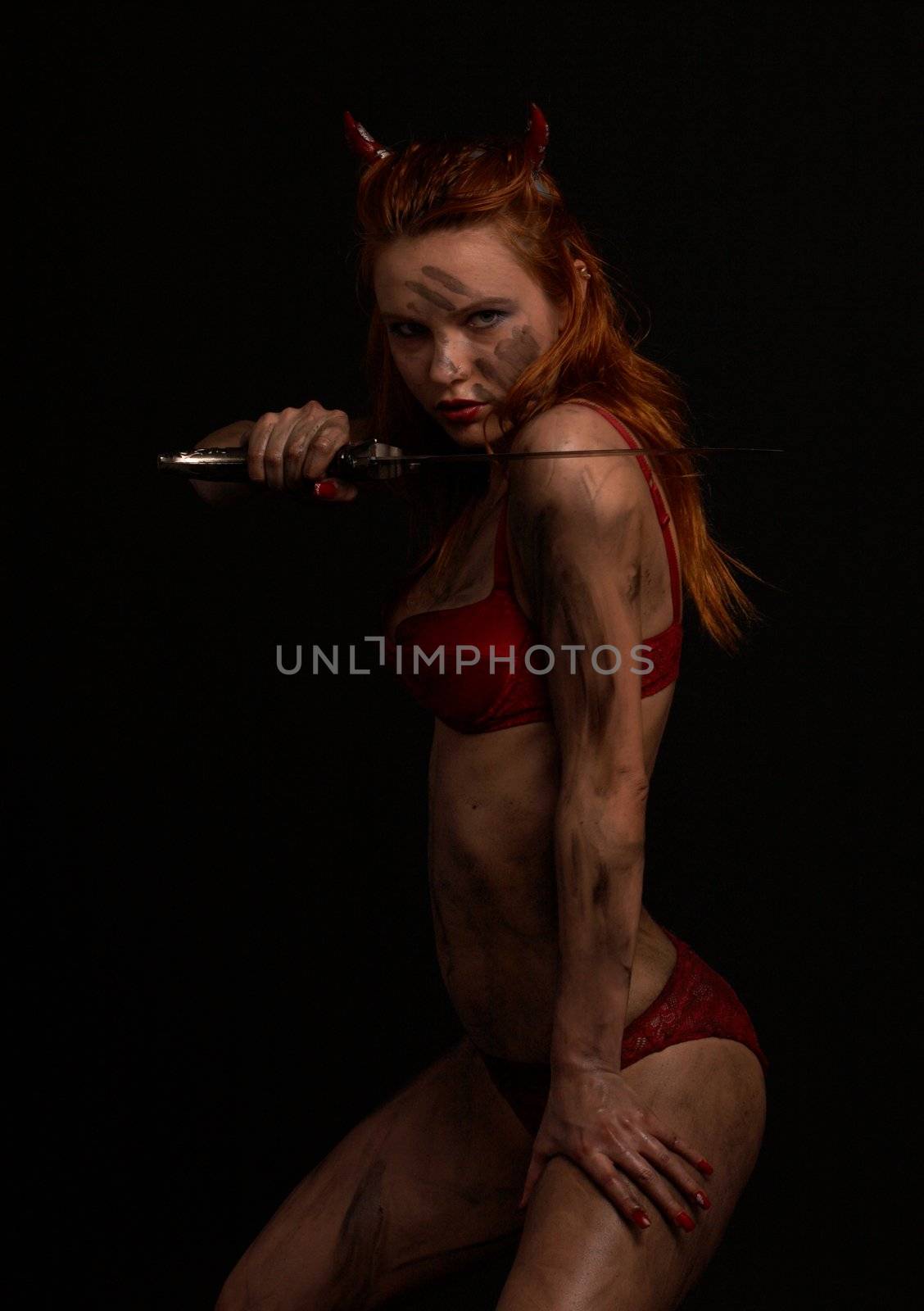 dark red devil girl with a knife over black