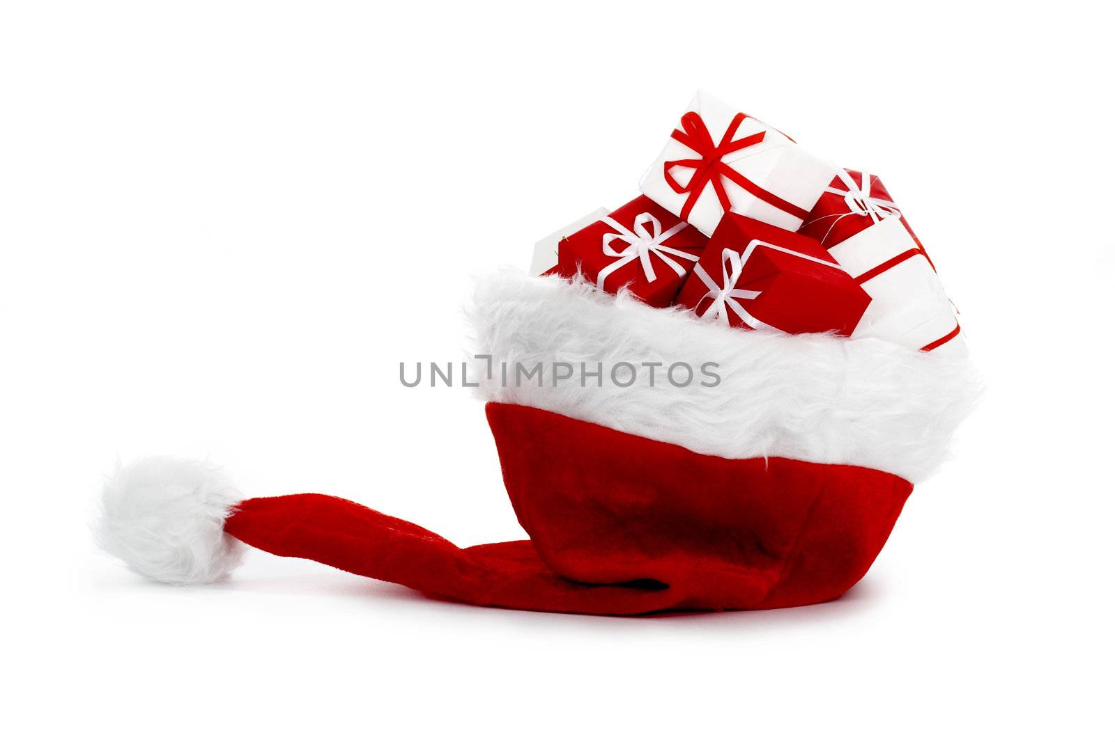 A red santa hat with gifts isolated on white background