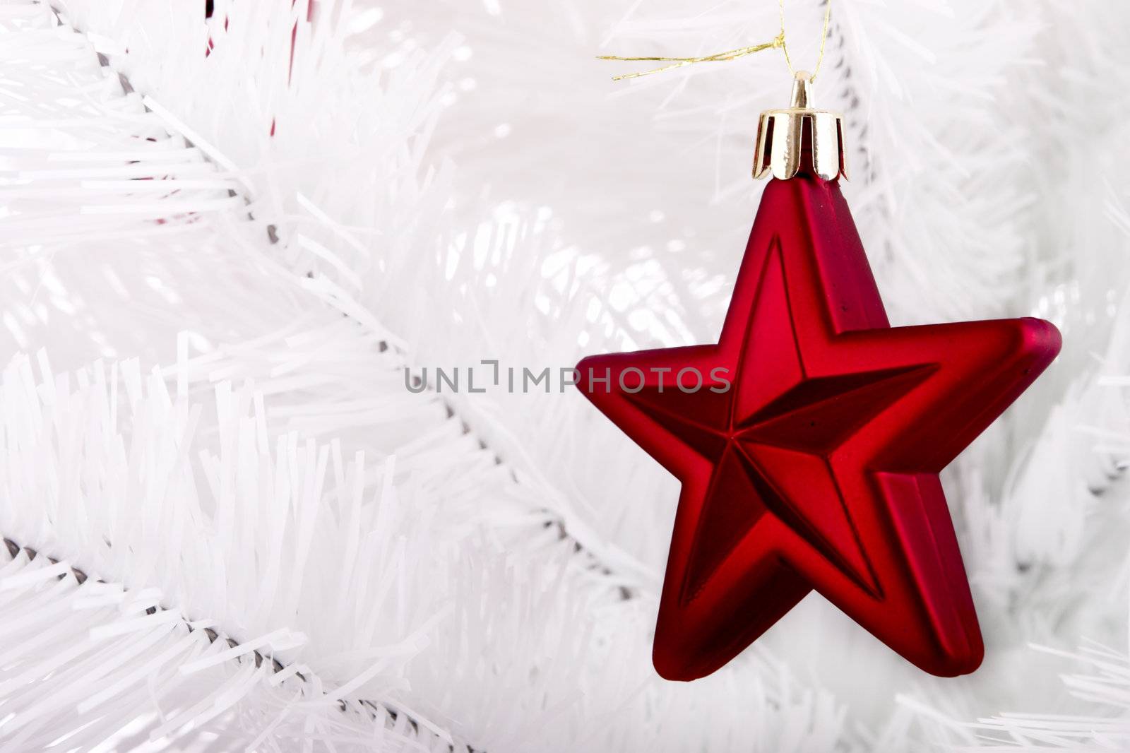 Christmas ornaments hanging from a white tree