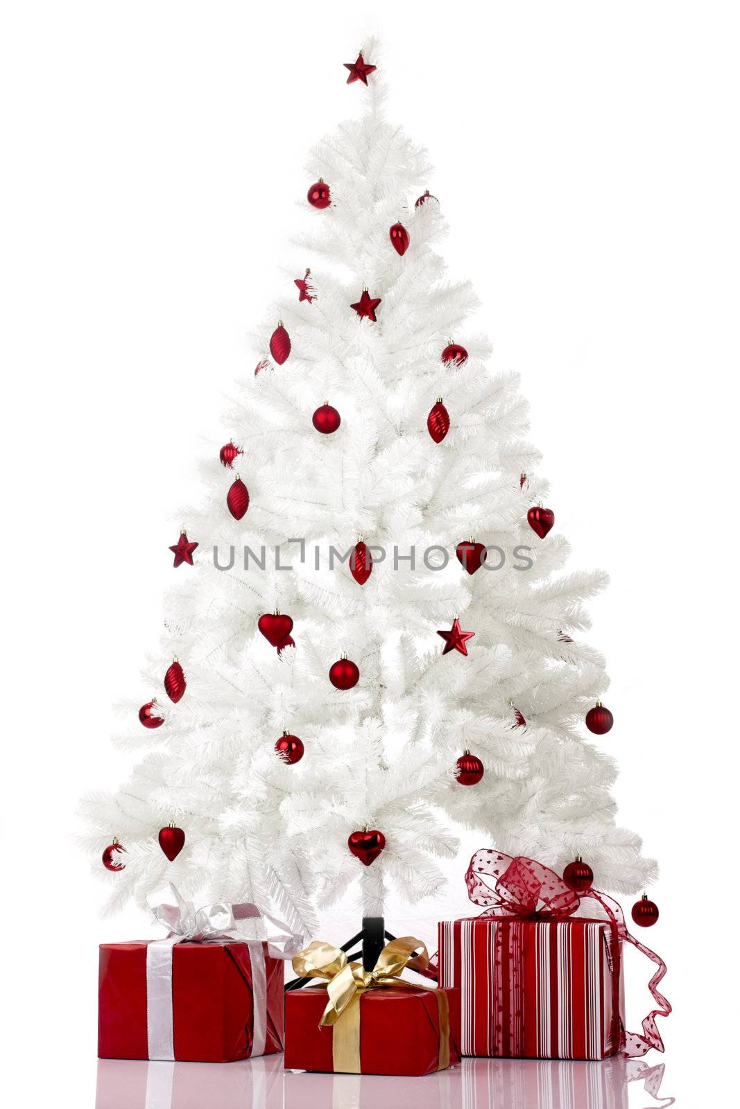 Christmas white tree and gifts over a white background