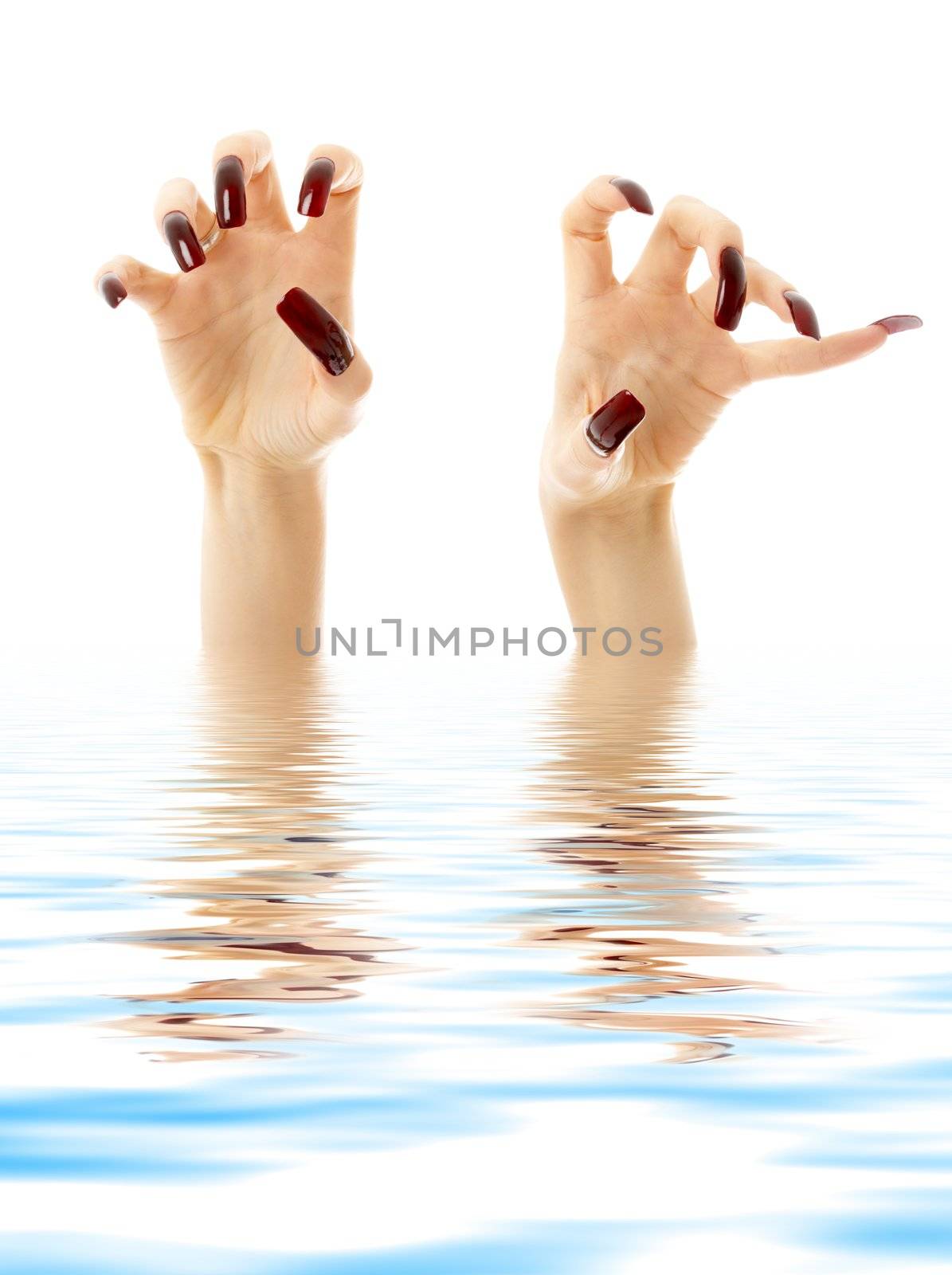 hands with long acrylic nails drown in water