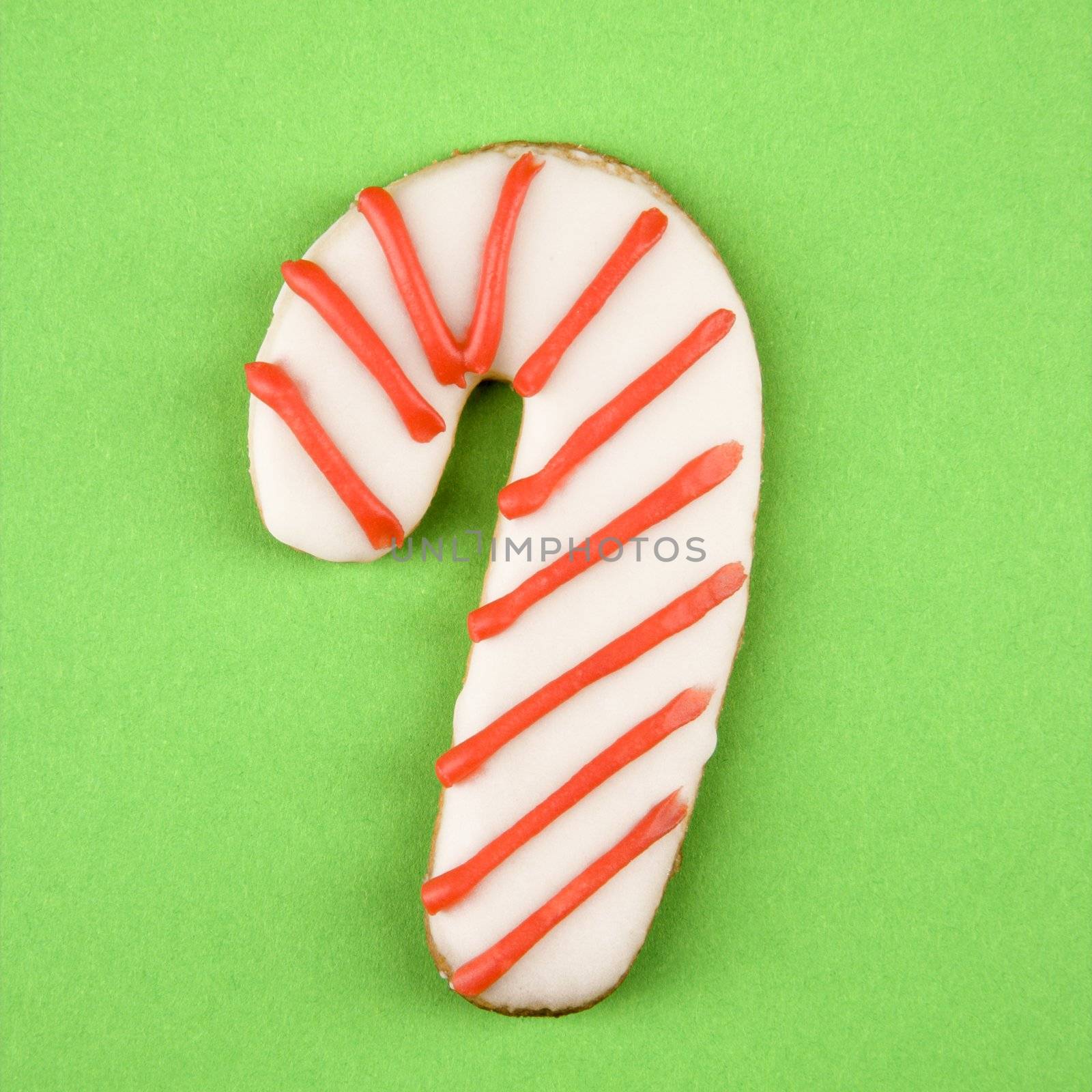 Candy cane sugar cookie with decorative icing.
