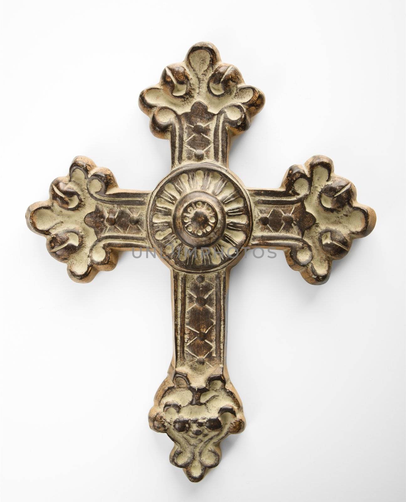 Ornamental religious cross against white background.