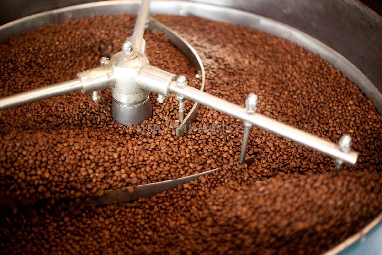 A machine which cools freshly roasted coffee beans.  Shallow depth of field, critical focus on center of machine