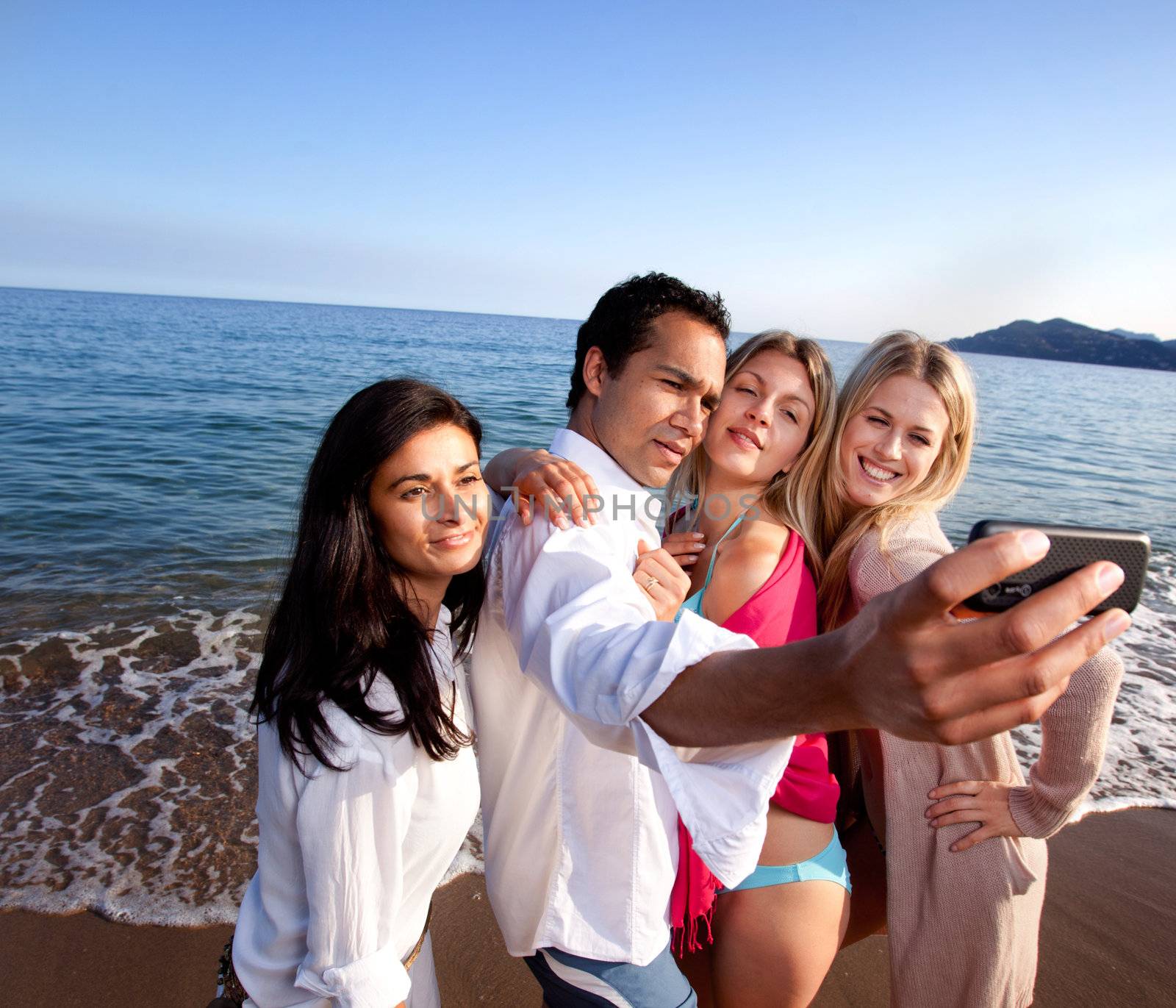 A group of friends taking a self portrait - room for copy space at top