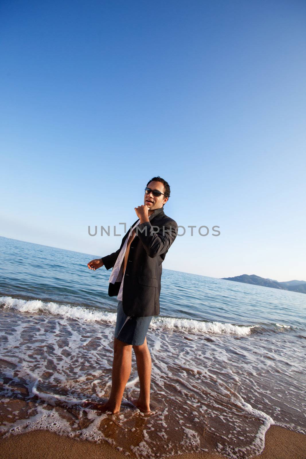 A business man on a holiday at the beach