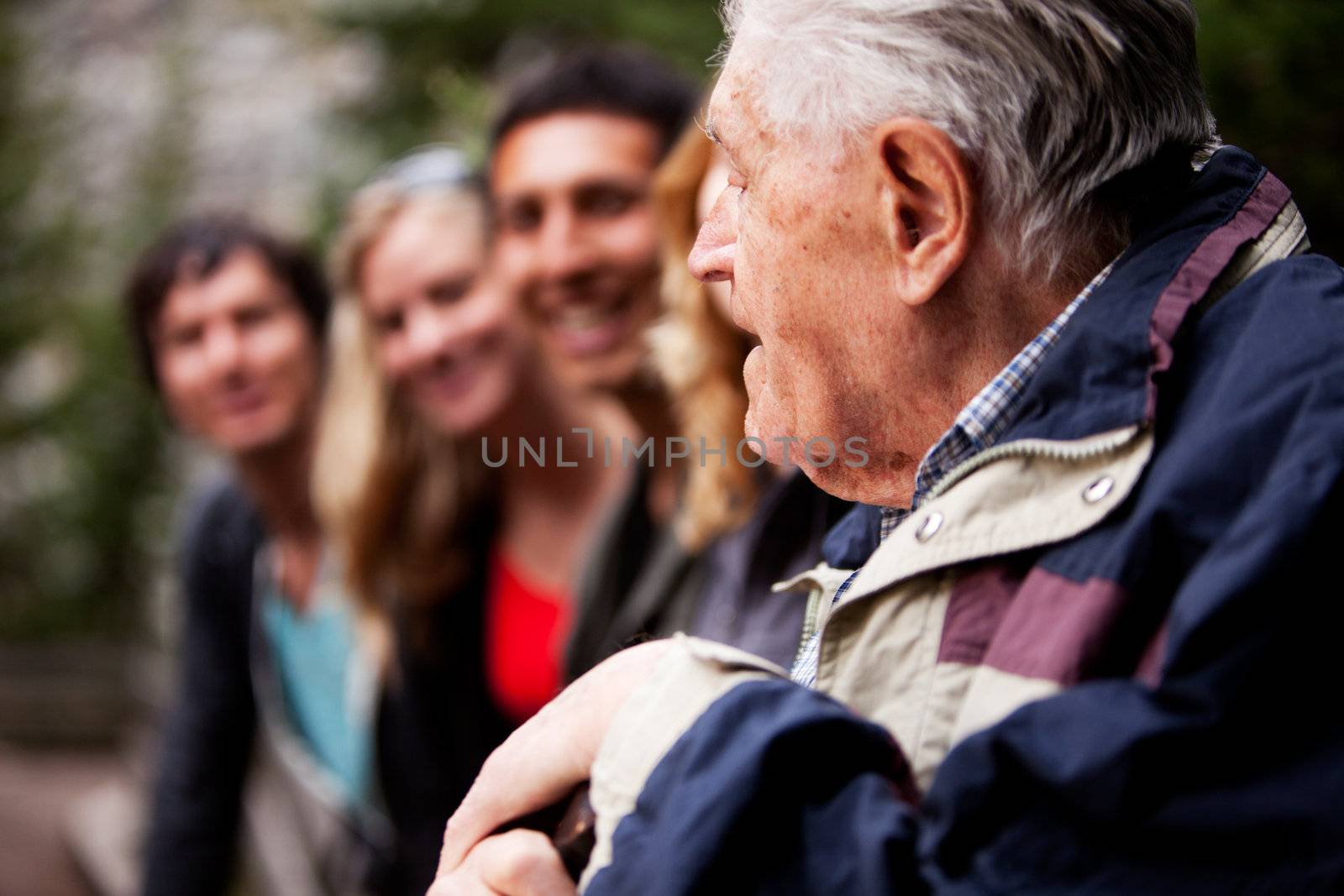 An elderly man telling stories