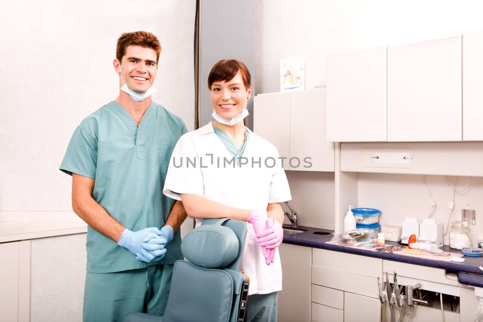 A portrait of a dentist and an assistant