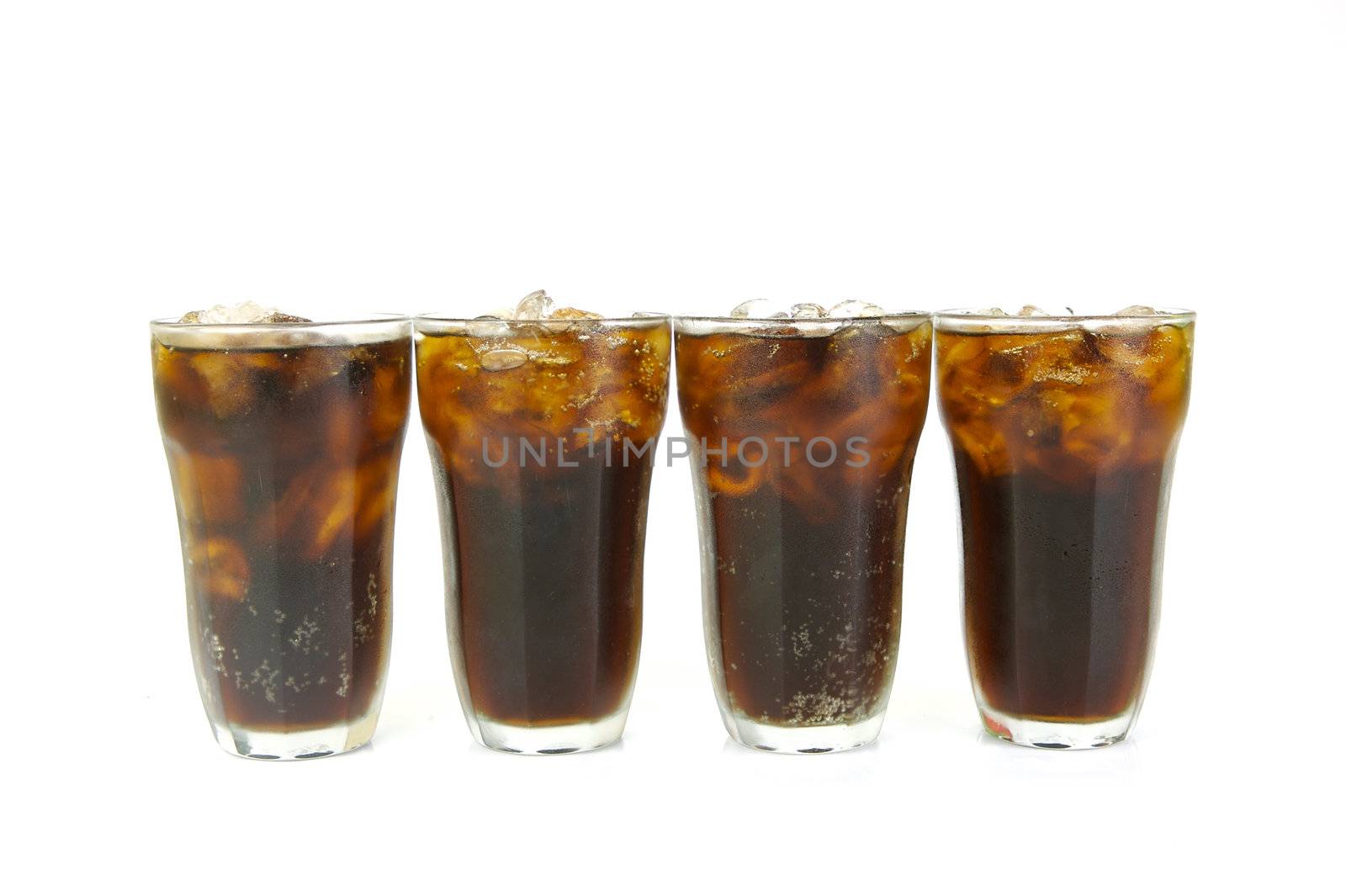 Glasses of cola isolated against a white background