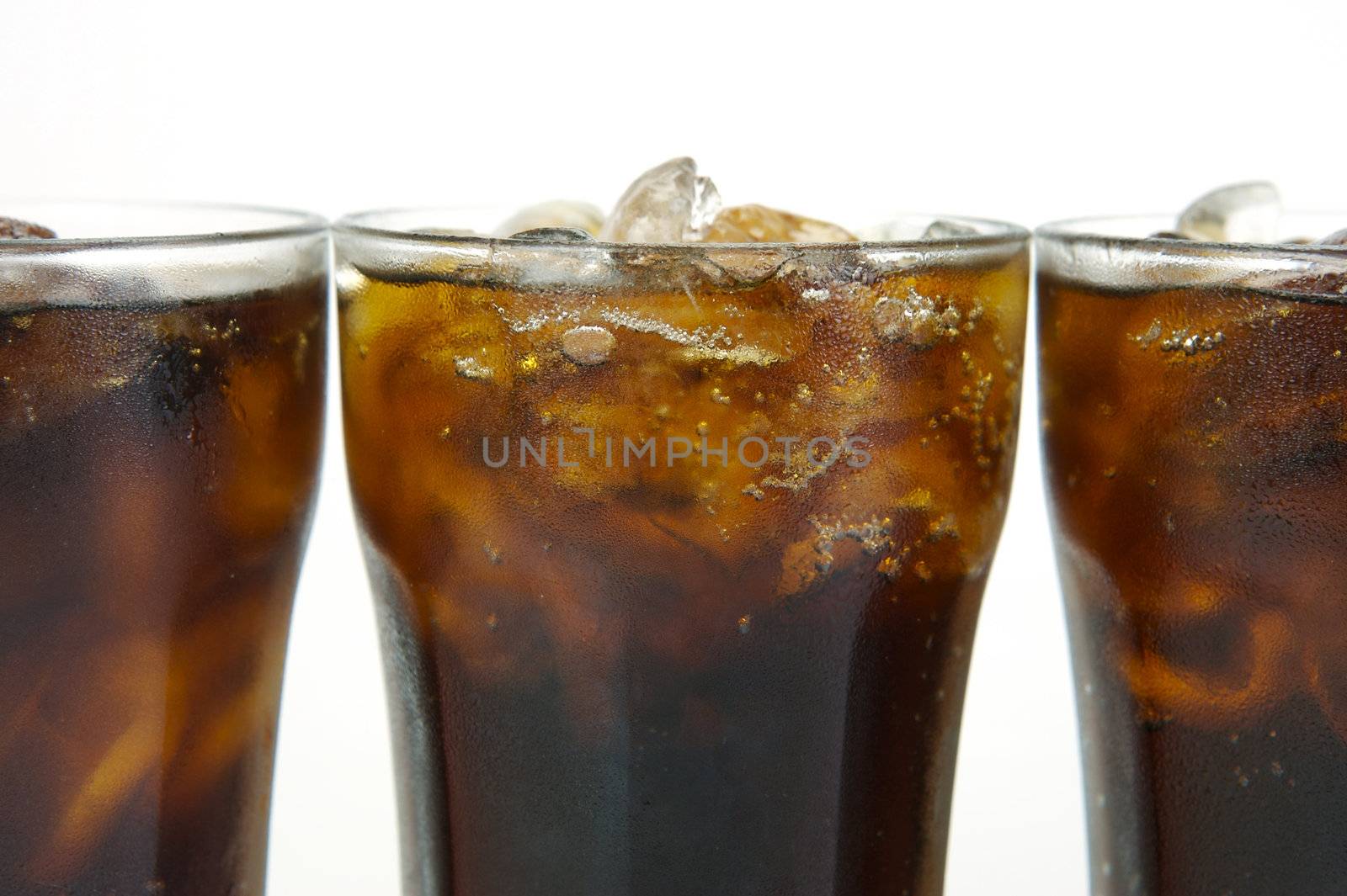 Glasses of cola isolated against a white background, Glasses of cola isolated against a white background