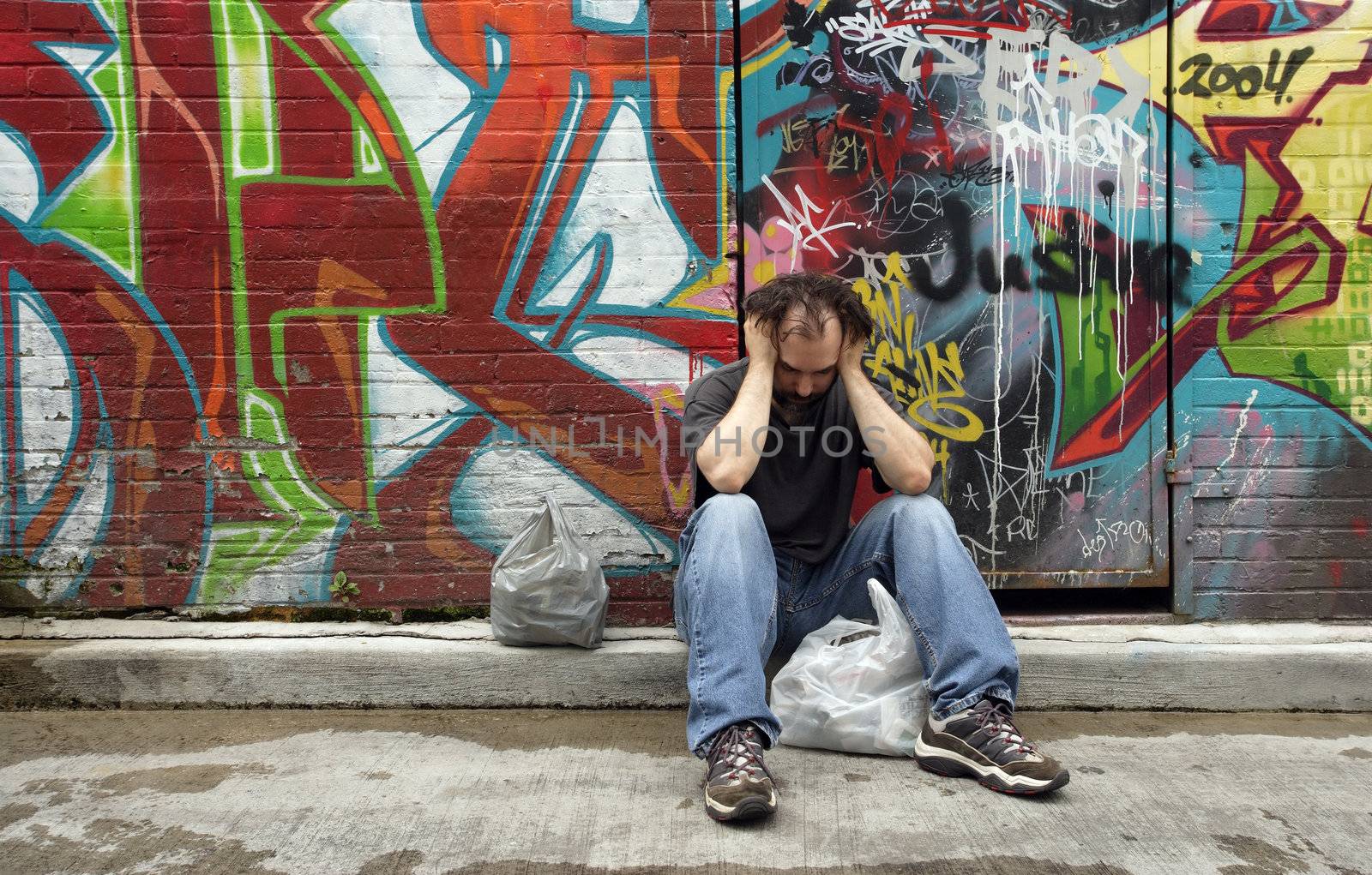 A homeless man on the city streets, filled with anxiety and hopelessness.
