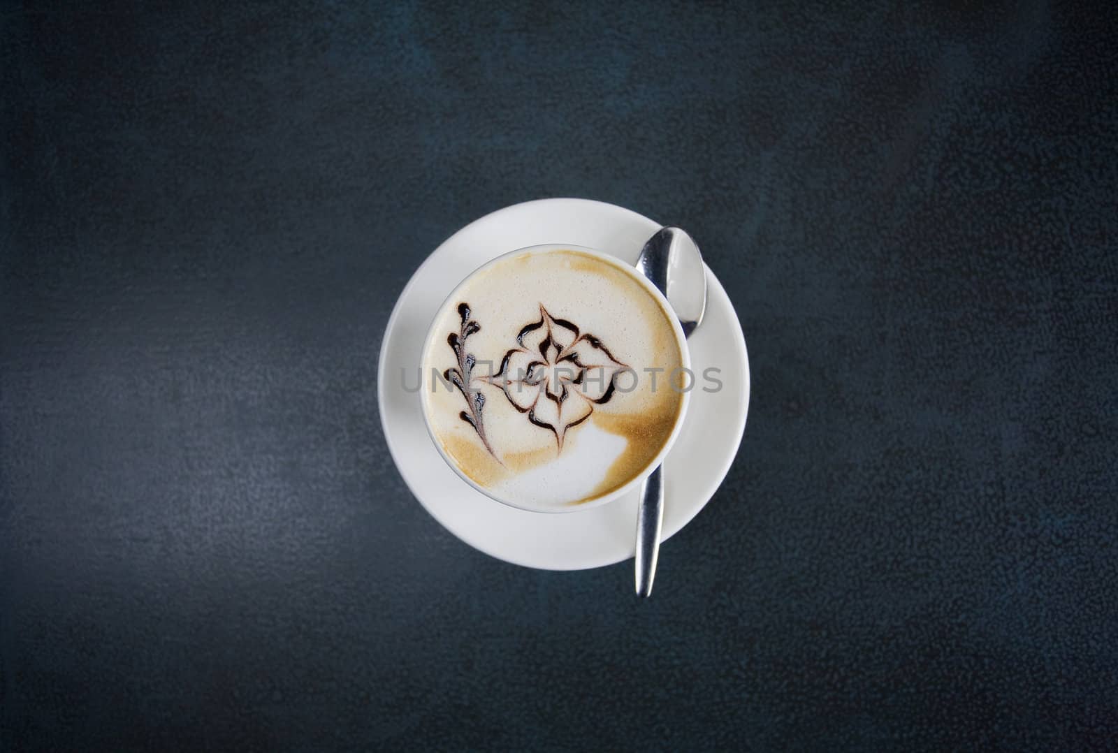 Cappuccino for breakfast at peaceful and nice little coffee bar in old town of Riga, Latvia.