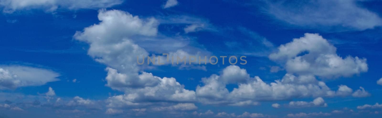 White clouds under blue sky