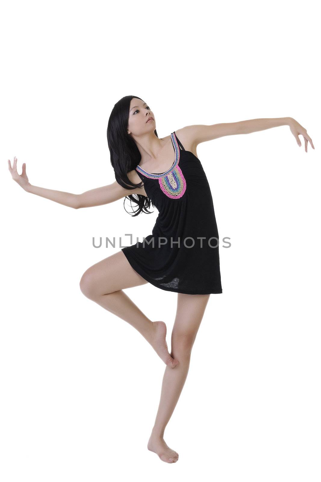 Modern ballet dancer dancing on white studio background.