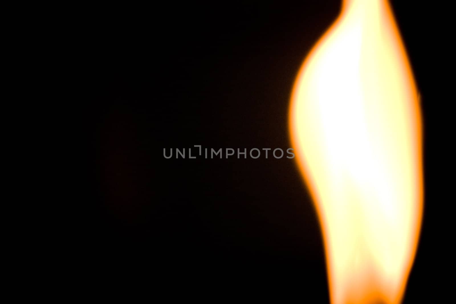 blurry fire flame raising in a dark background