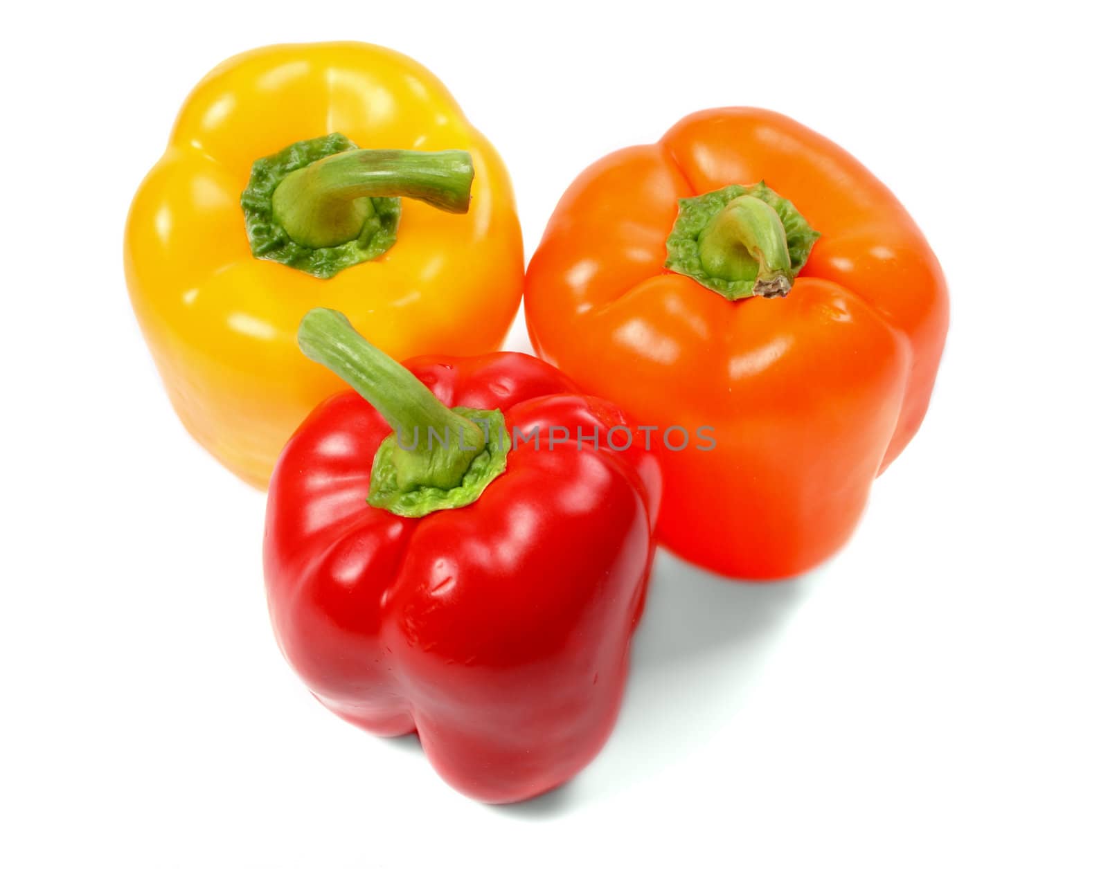 group of fresh paprikas isolated over white