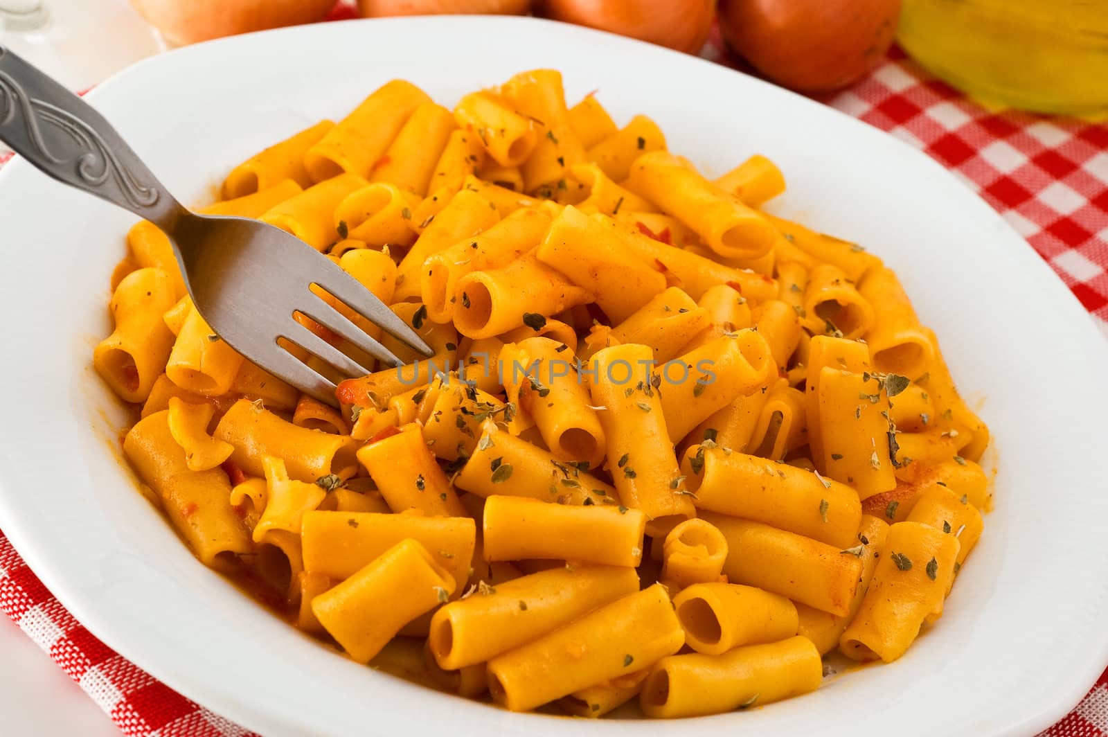 Italian pasta with tomato sauce, studio shot.