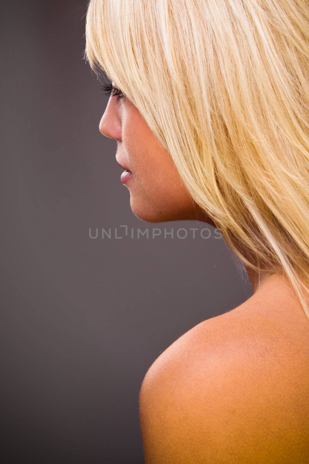 Profile Closeup Portrait Of A Young Beautiful Blond Woman