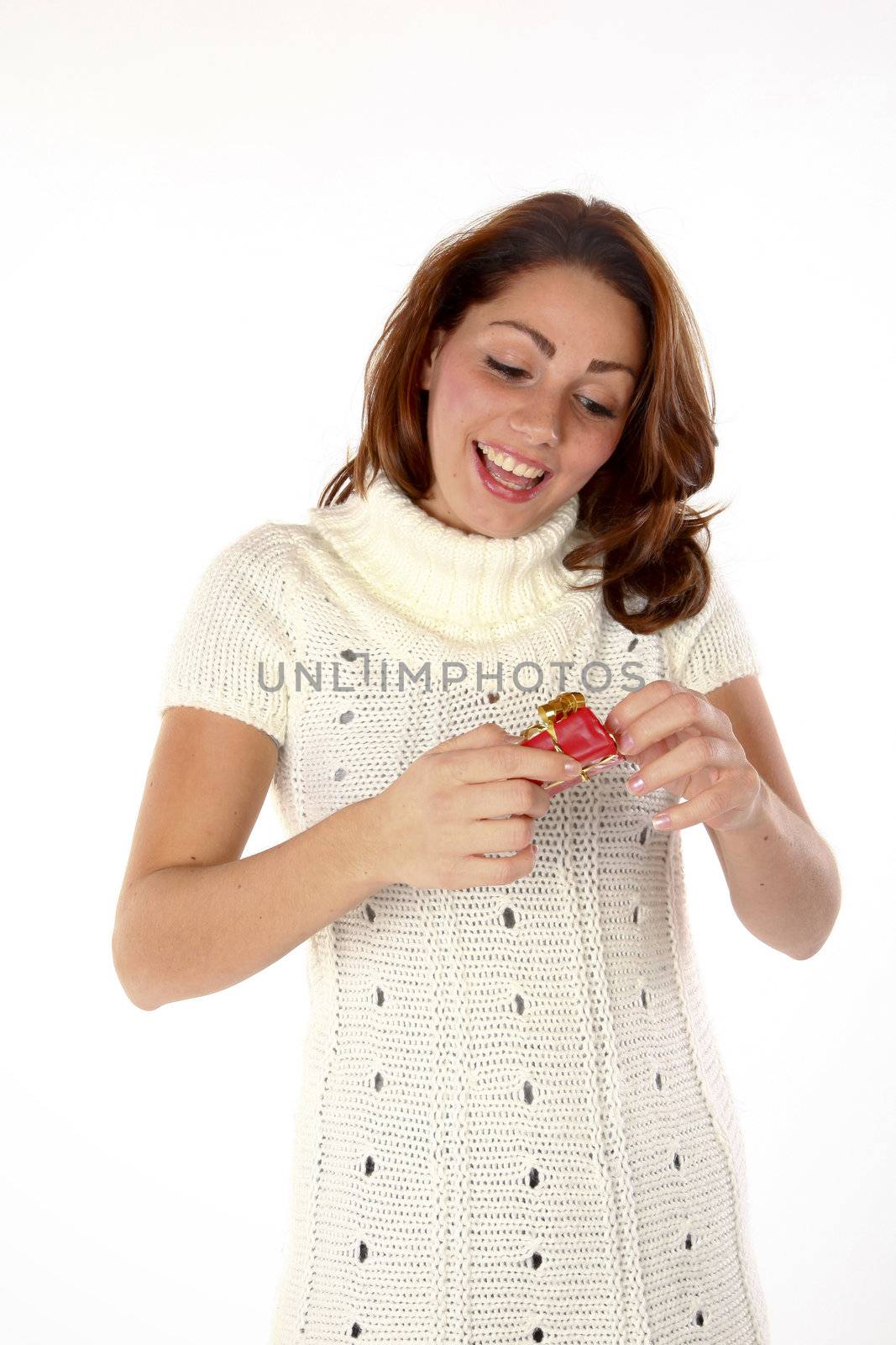 Cheerful Beautiful Woman Unpacking A Christmas Gift