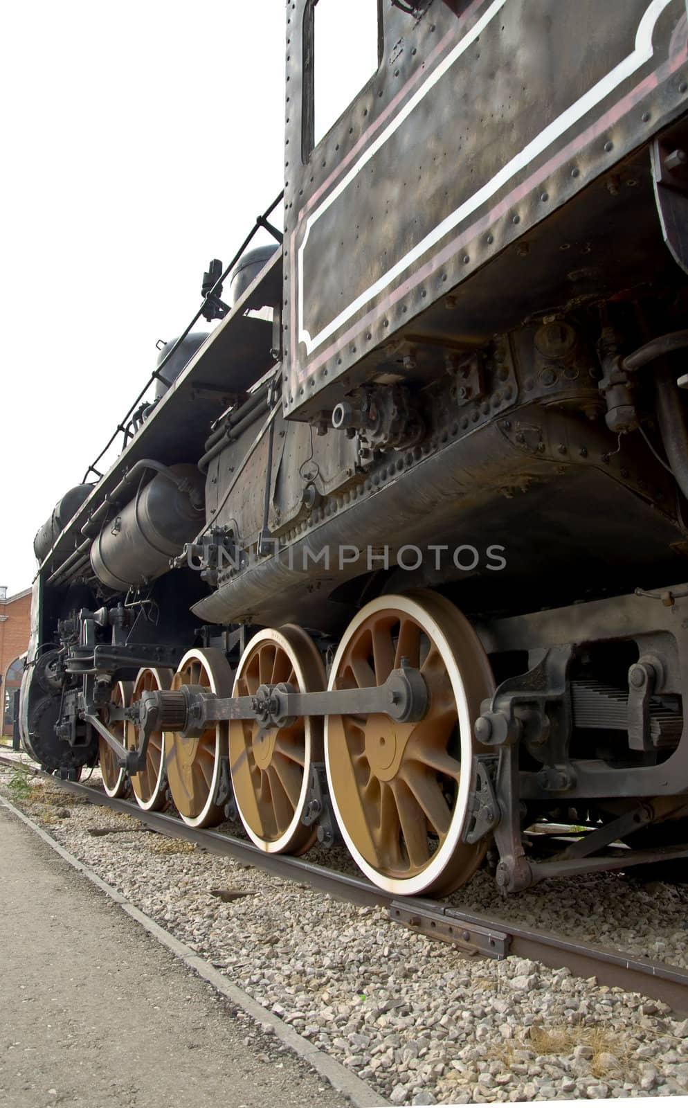 Old locomotive wheels close up. Steam train.