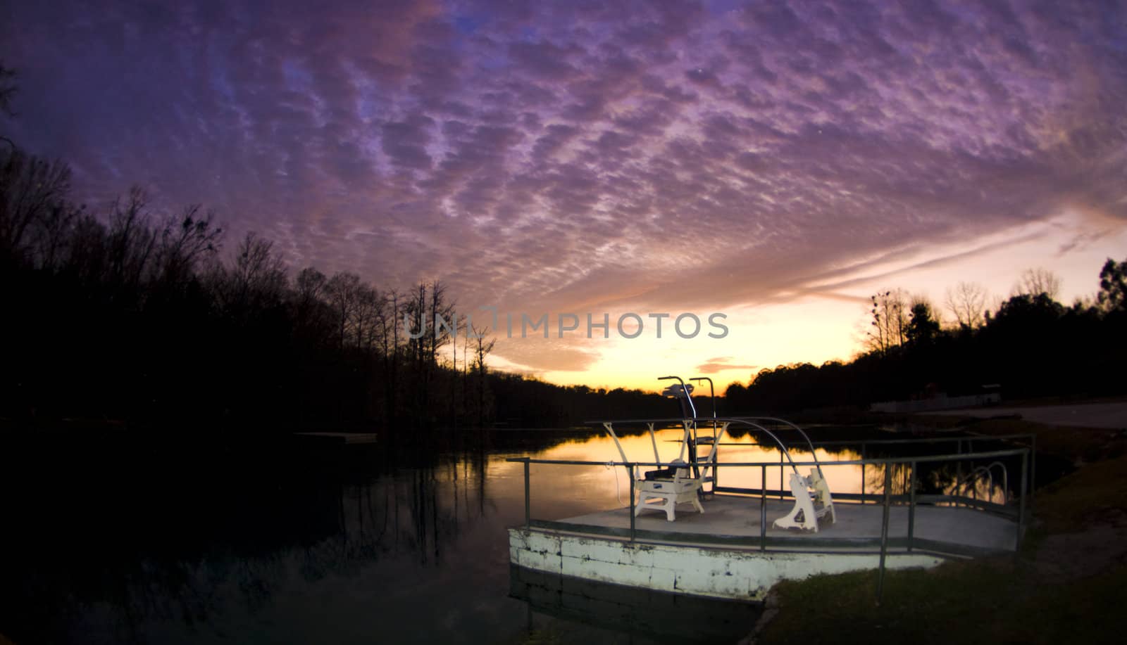 A dramatic sunset over the Jackson Blue Springs Millpond in Marianna Florida