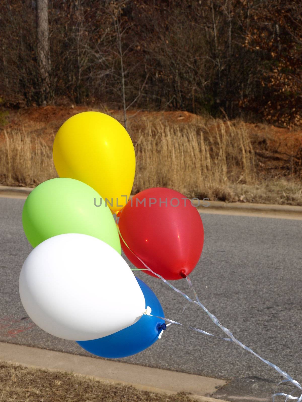 Five balloons showing where to turn in for the party