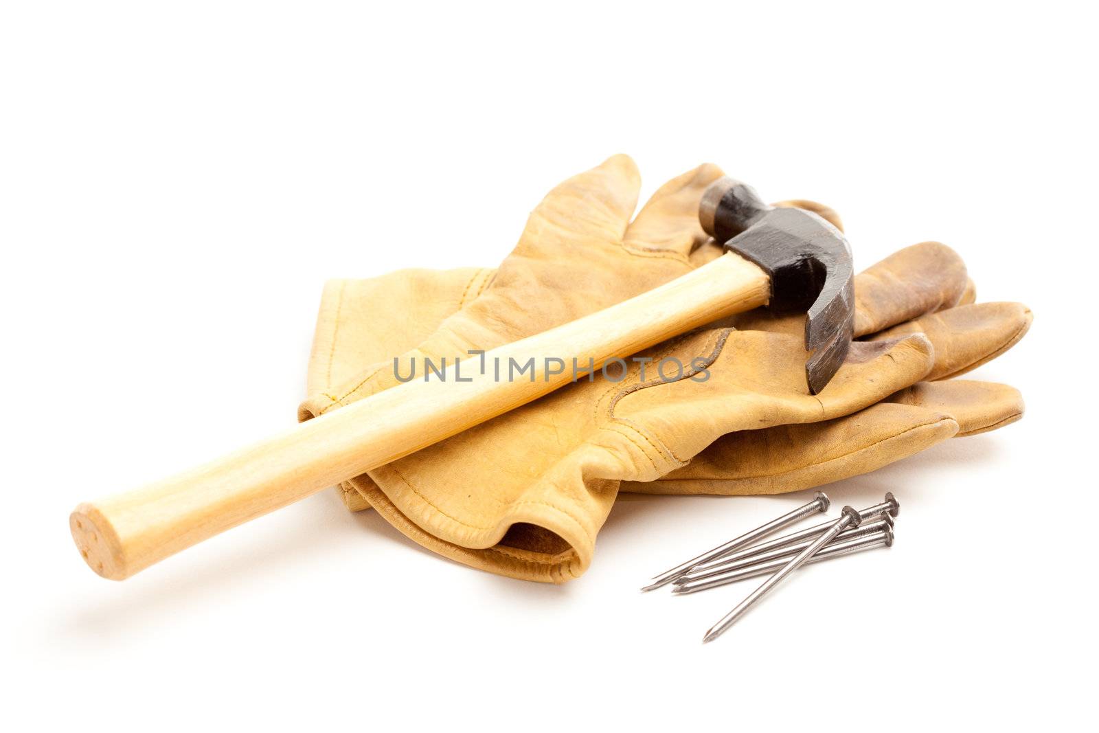 Hammer, Gloves and Nails Isolated on a White Background.