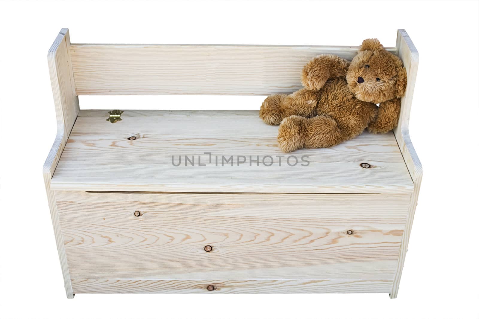 Teddy bear sitting on a childs toy box isolated on a white background