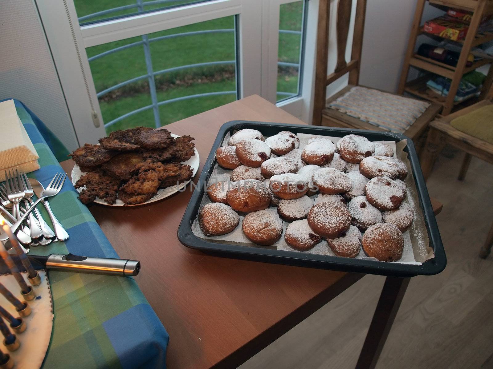 Delicious Traditional Jewish Hanukkah doughnut suganuyot and potato latkes