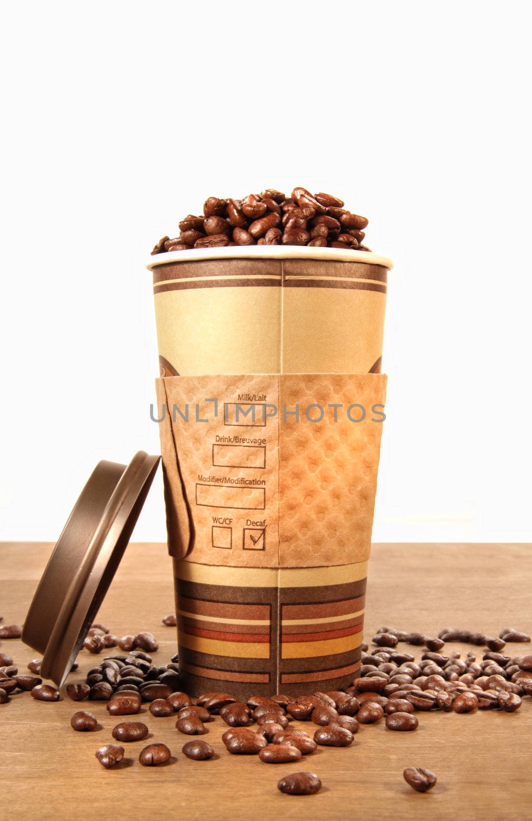 Disposable coffee cup with beans with white background