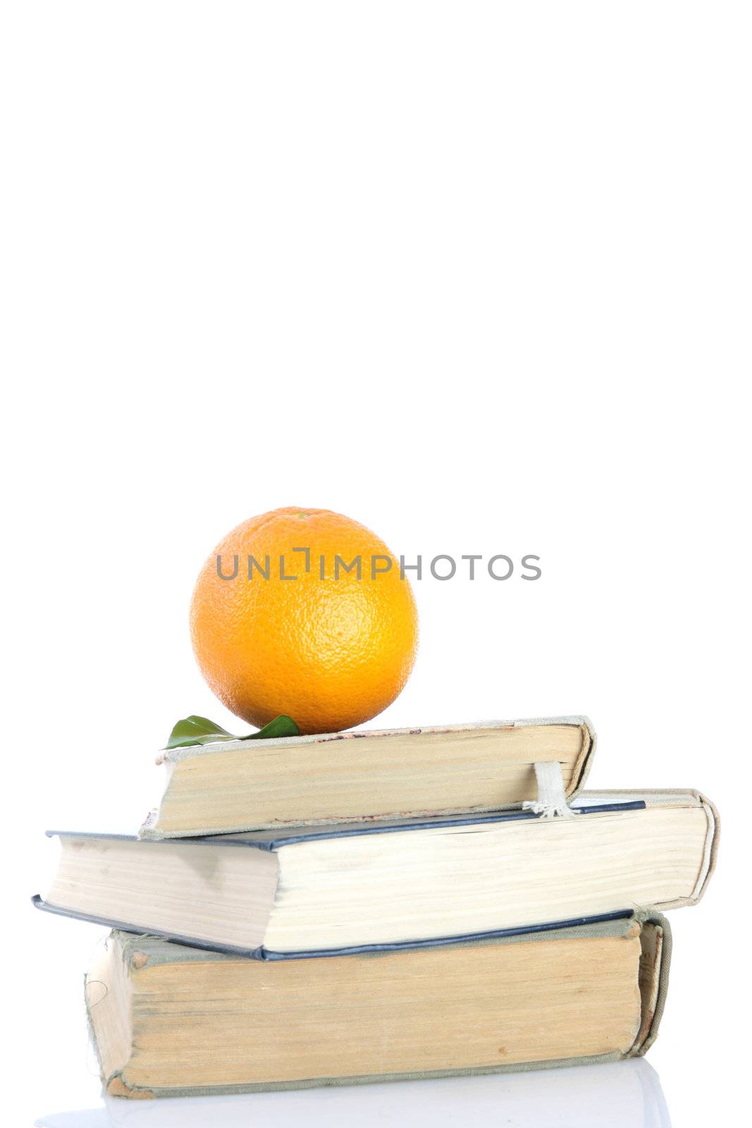 orange on books isolated on white