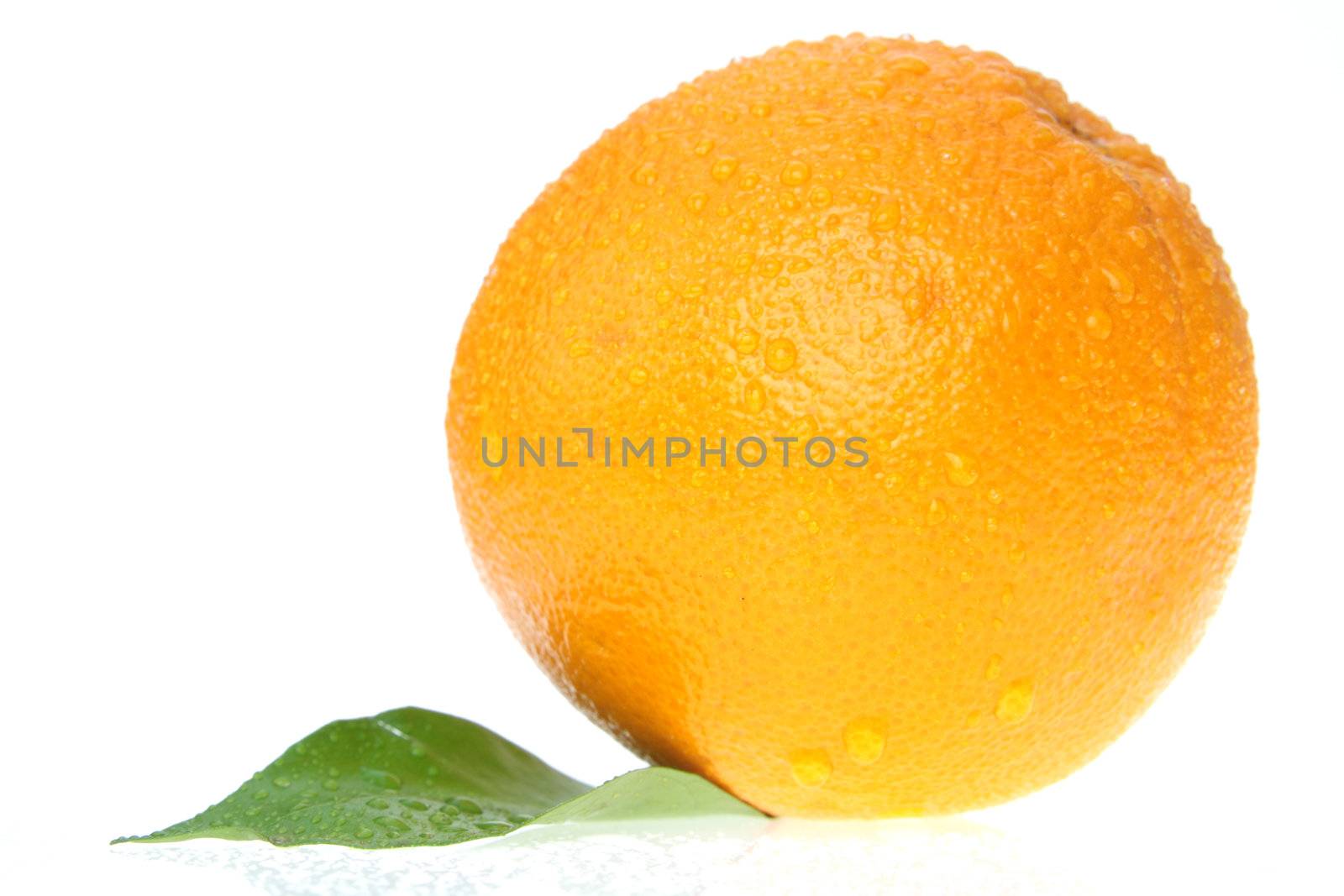 Orange with water drops islolated on white