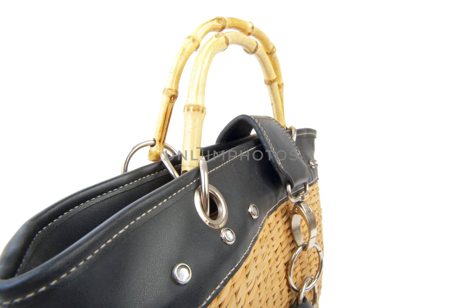 Wattled handbag with leather and steel elements. Isolated on white background